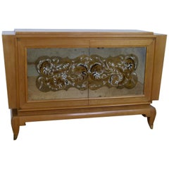 Commode des années 1945 en sycomore et miroir églomisé de R. Prou