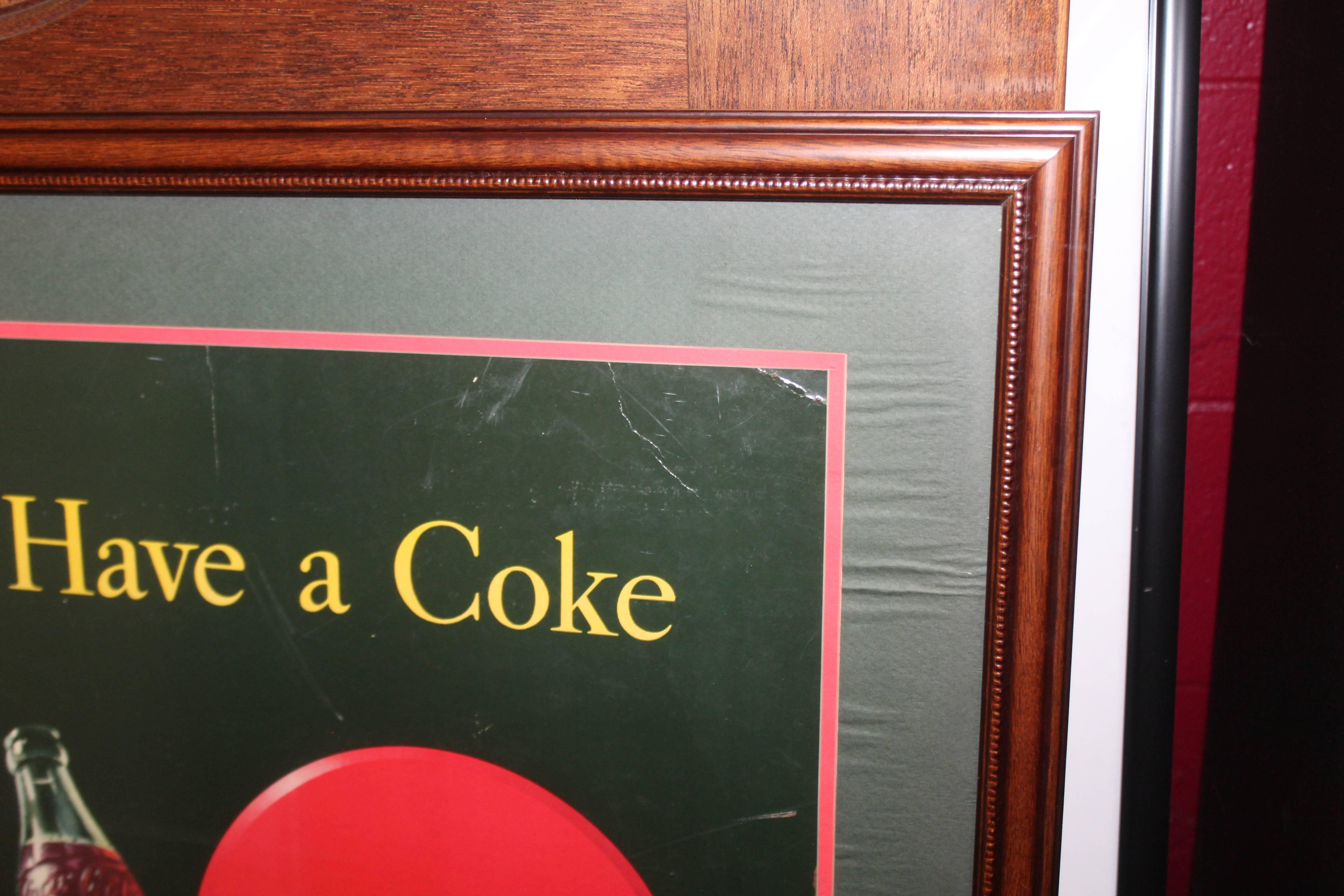 This is another style of coca cola advertising made of cardboard. Nicely framed and preserved over the year. Its vibrant colors and great visual of the Classic pinup era.