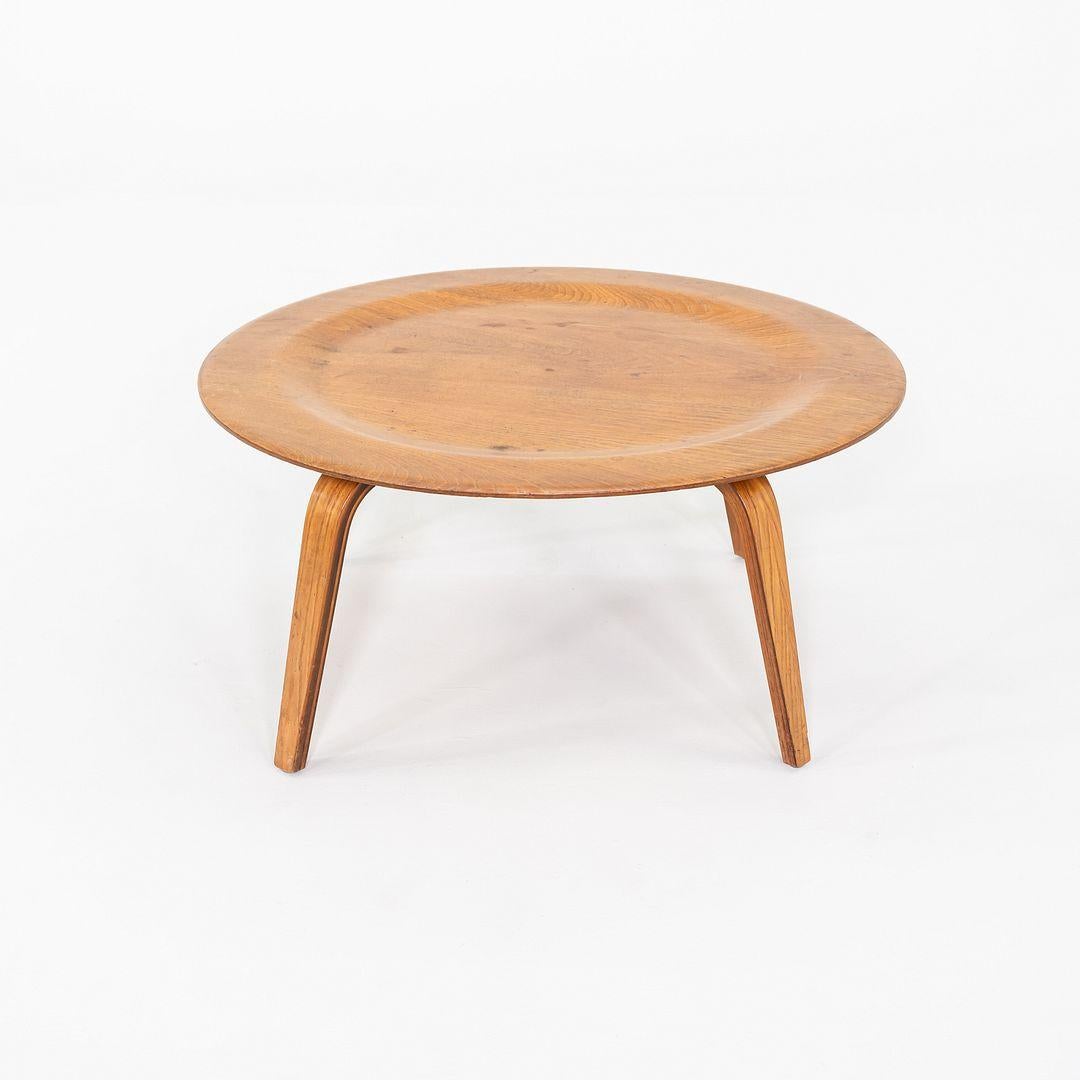 This is a CTW Circular Wood Leg Coffee Table, initially designed by Ray and Charles Eames for the Evans Molded Plywood Company in 1946. It was released as a part of the 