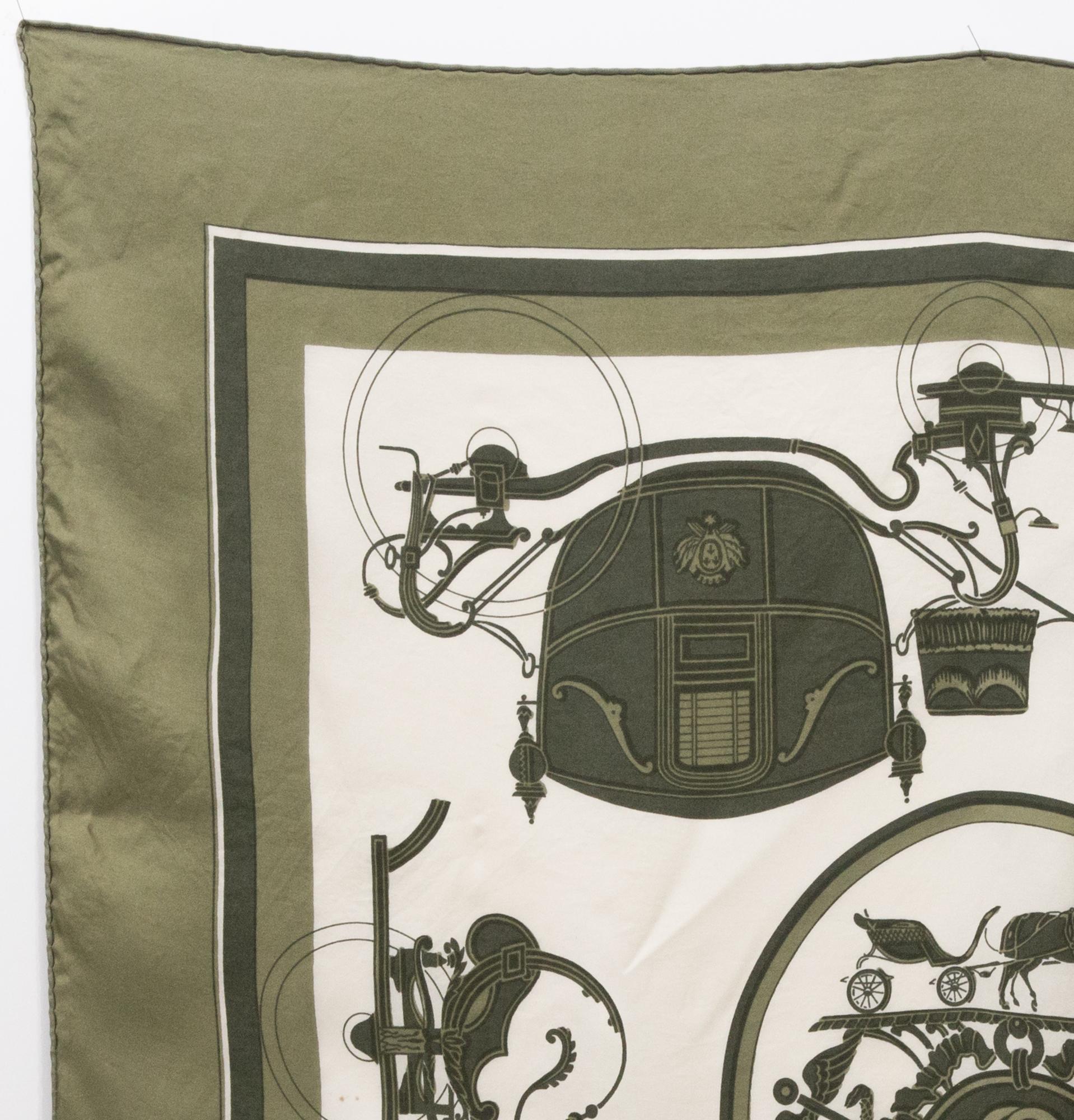 Hermes « Ex Libris » by Hugo Grygkar silk scarf featuring a khaki border and a Hermès signature. 
Circa 1946
In good vintage condition. Made in France.
35,4in. (90cm)  X 35,4in. (90cm)
We guarantee you will receive this  iconic item as described and
