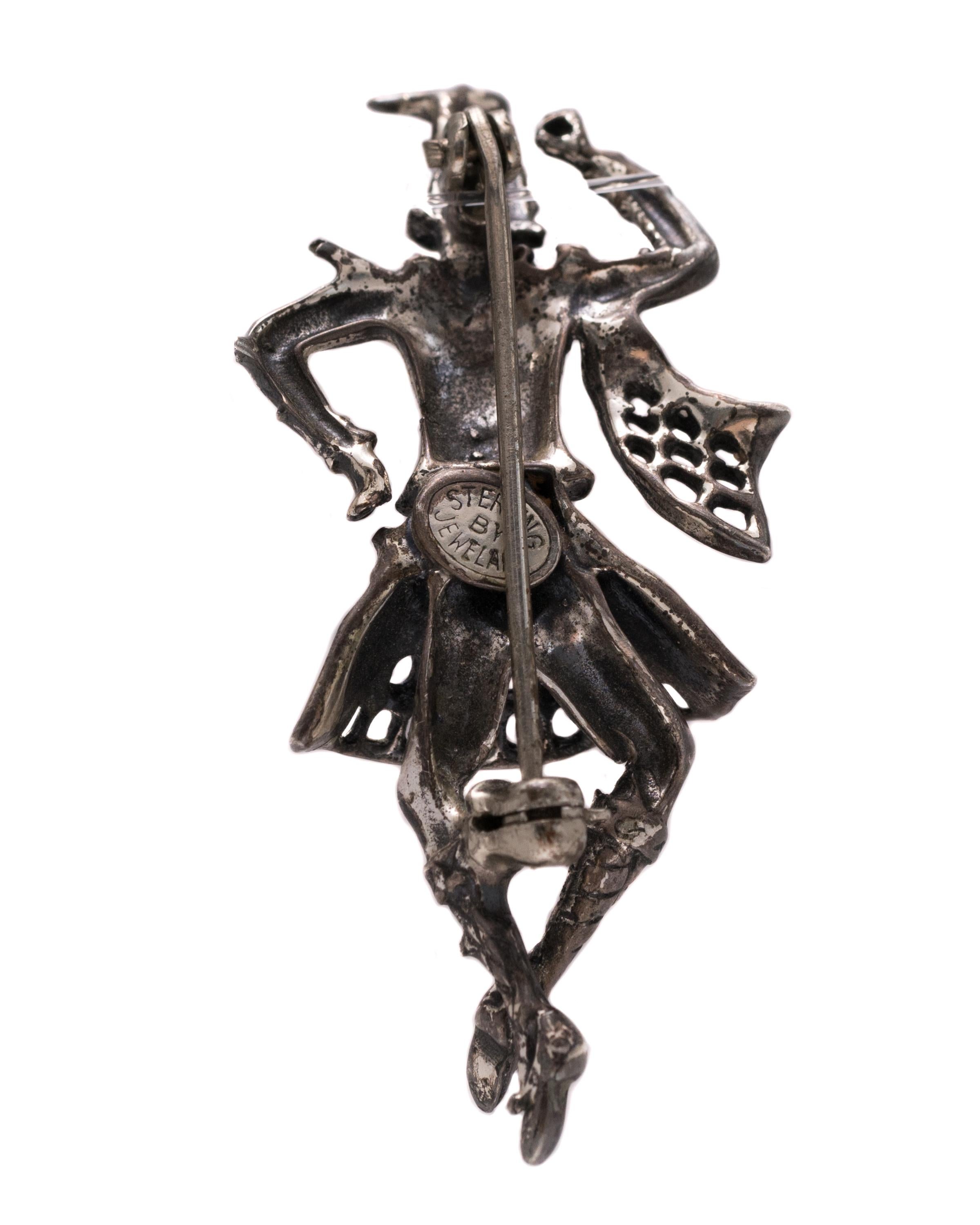 1946 Retro Collectible Scottish Highlander Dancer Pin - Sterling Silver

Features:
Exquisitely Detailed throughout
Crafted by Jewel Art Company of Providence Rhode, Island
Crafted from Sterling Silver
Pin measures 5 x 2.5 centimeters, 1.3