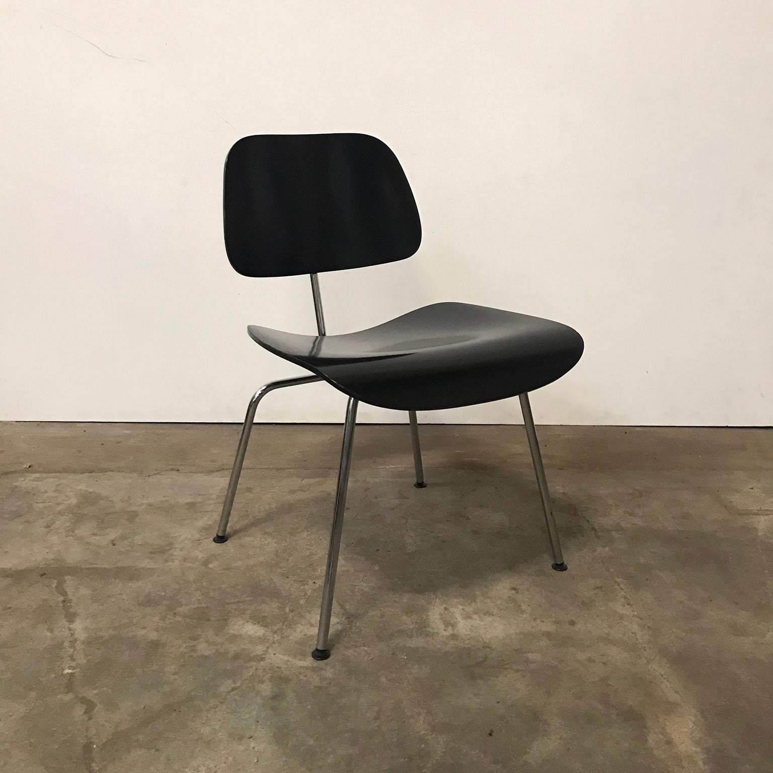 Set of six DCM in black by Vitra. Only for sale as a set. The chairs show traces of use like some scratches and some loss of paint/lacquer at some spots. The bases are in good condition. 
Also other DCM are available in black and one in red by Vitra