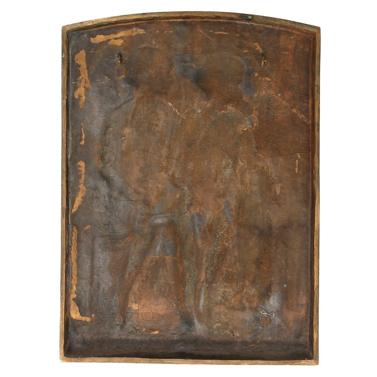 A bronze plaque of a boy and a girl in profile, seated on a bench and holding hands. Marked: April 1947 c Warner Williams
Gorham Co. Founders.