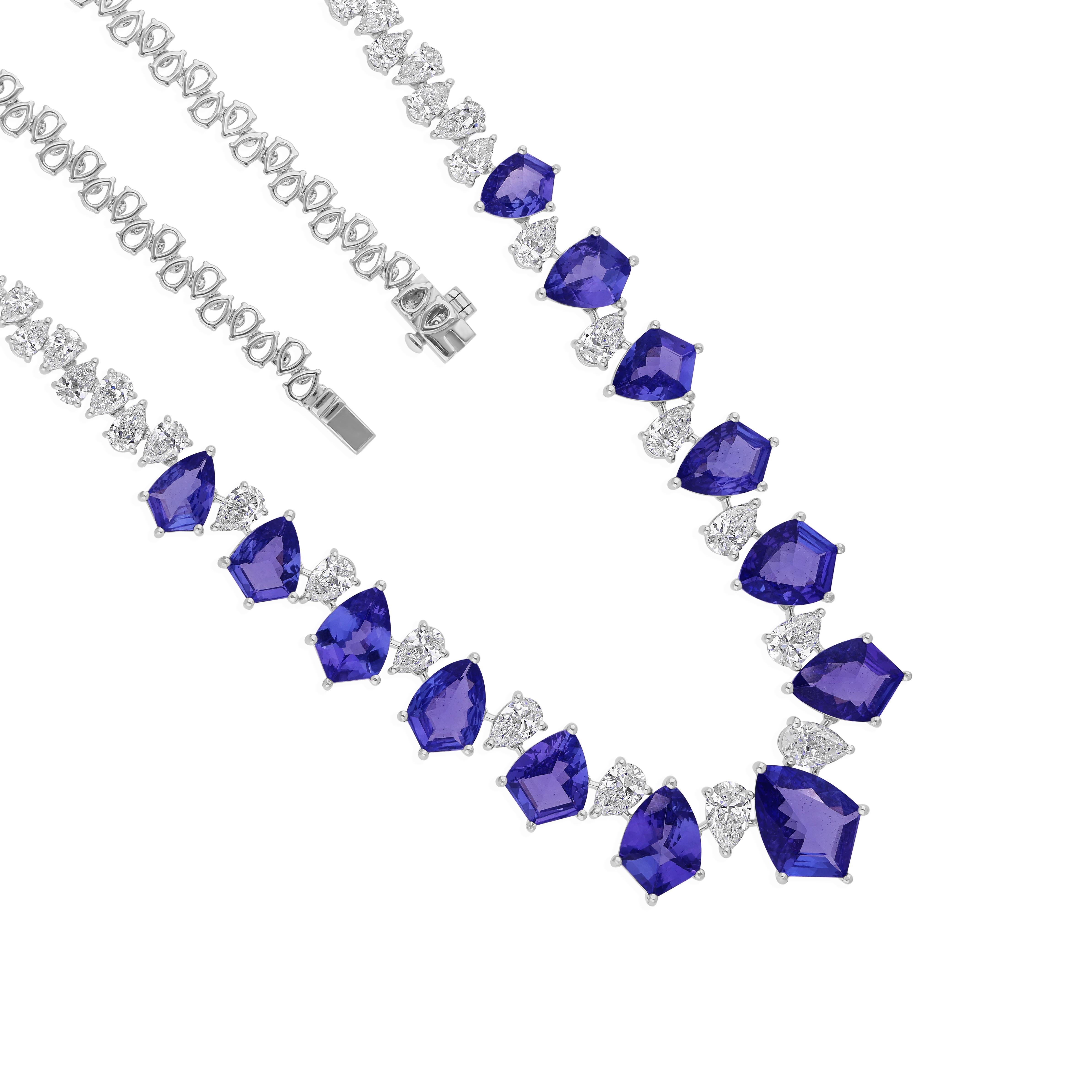 Cast from 18-karat gold, these exquisite necklace is handset with 19.47 carats tanzanite and 9.05 carats of sparkling diamonds.

FOLLOW SPECTRUM JEWELS storefront to view the latest collection & exclusive pieces. Spectrum Jewels is proudly rated as