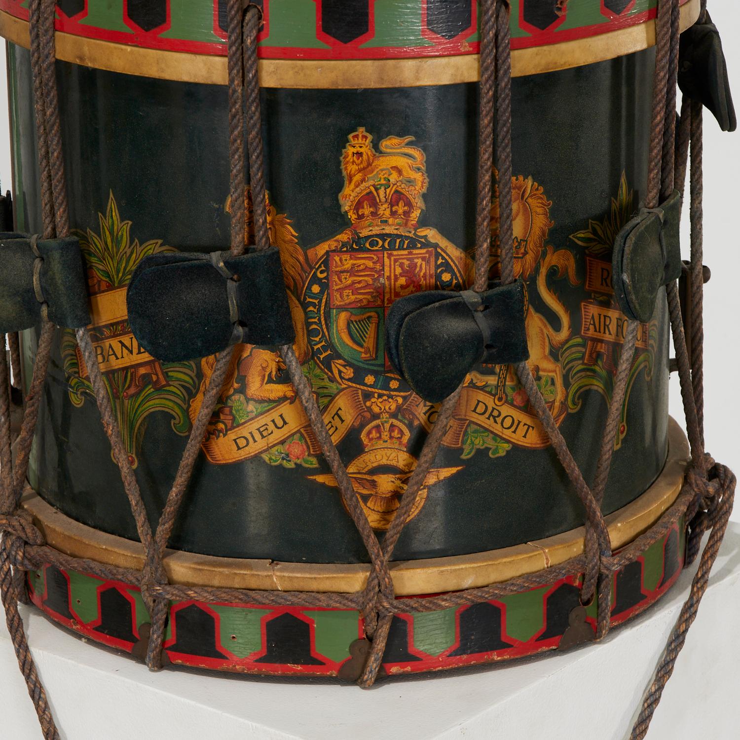 1947 England, a hand painted Premier Percussion British Royal Air Force drum. The drum has been painted with a black main body, a richly colored royal coat of arms and the motto of the British monarch 