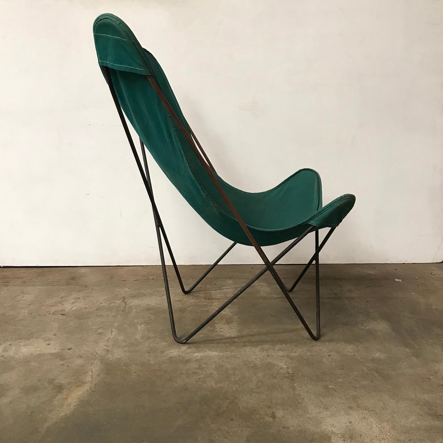 Please ask Casey Godrie Ibiza/Amsterdam for a competitive shipping quote.

Green butterfly in green canvas and black base. This butterfly fits in all kind of interior. The chair shows traces of wear like fading of color of the canvas and some stains