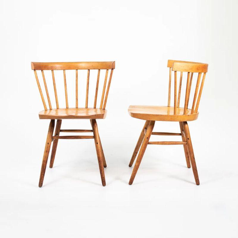 Listed for sale is a gorgeous pair of early George Nakashima for Knoll N19 birch straight chairs, produced by Knoll Associates. This chair appears to be natural birch. It shows some wear from use as can be seen in the photos. There are some light