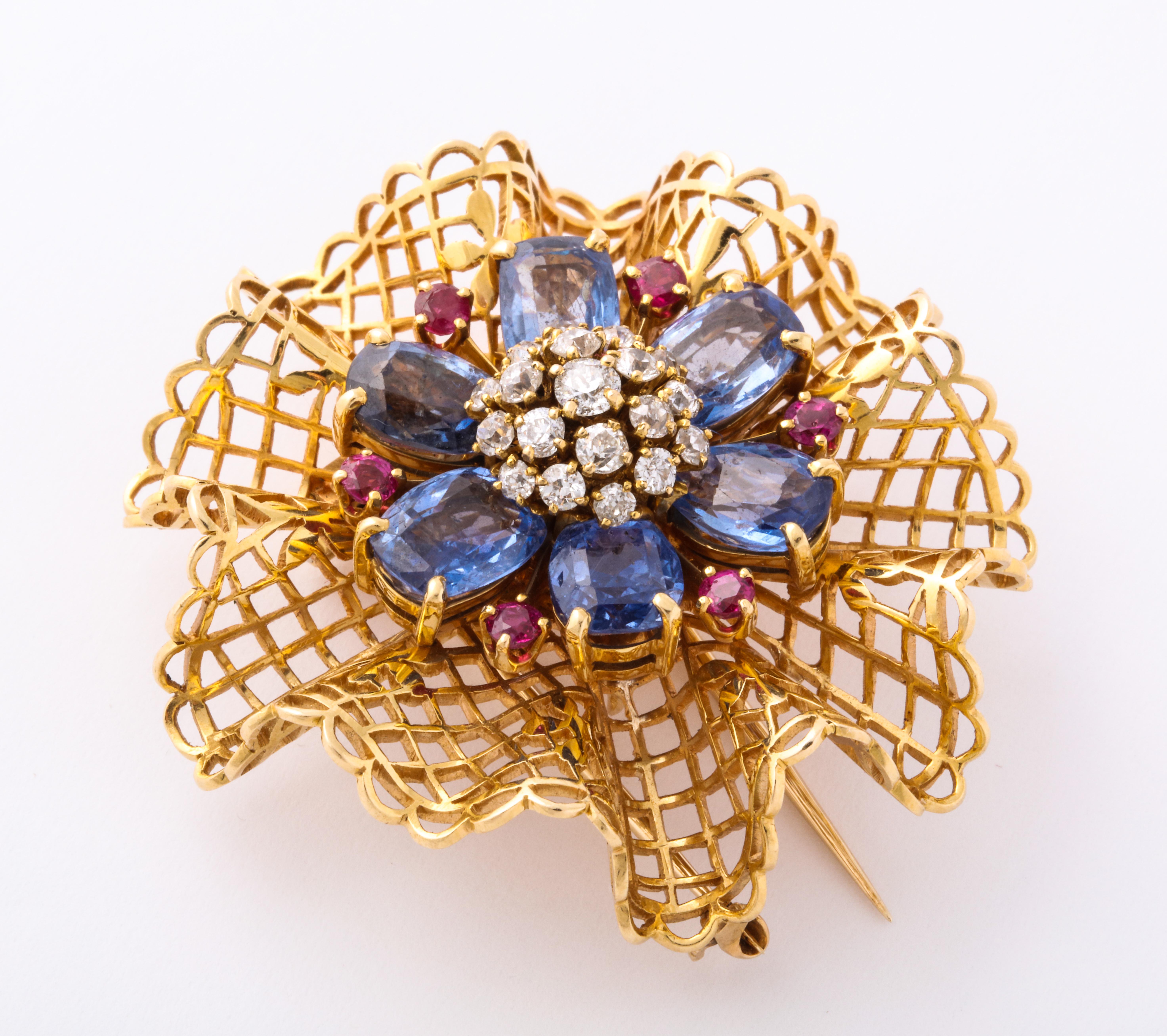 This stylish dentelle brooch made by the legendary Van Cleef and Arpels uses diamonds rubies and sapphires to depict a floral shape. 

Inspired by a ballerina's dress. A classic VCA motif

Signed and serial numbered

For similar see page 214 Van