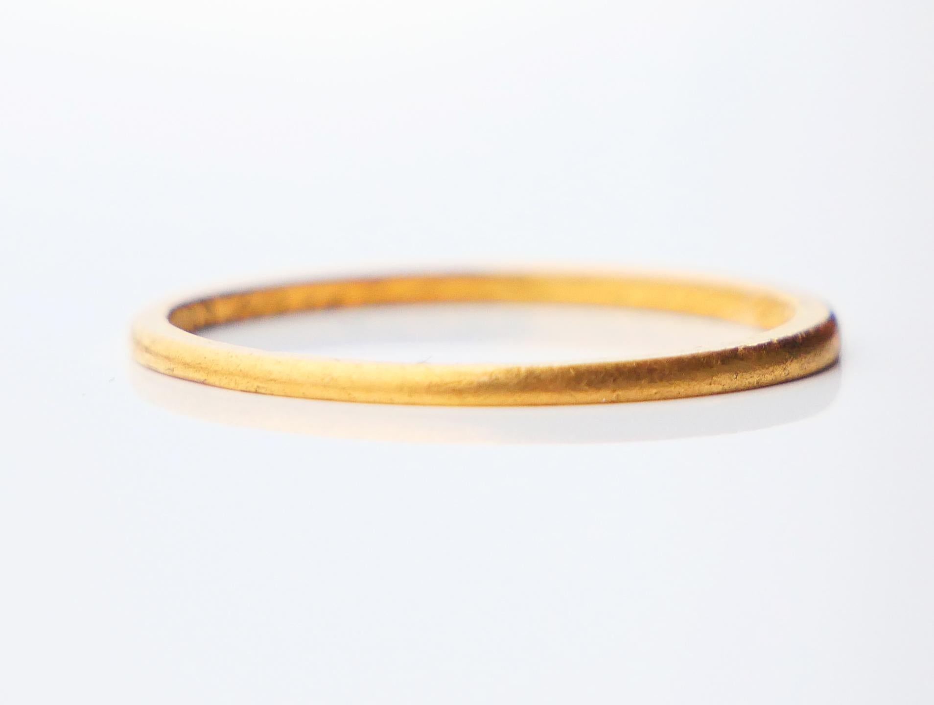 23K Wedding Ring. Made in Sweden. Unknown workshop, city of Stockholm, hallmarked 23K. Boliden.

Year mark: V8 / made in 1947. Worn engraving with names and date.

The band is 1.25 mm wide. Size: Ø 6.25 US / 16.71 mm. Weight: 1.26 gr.

Fine used