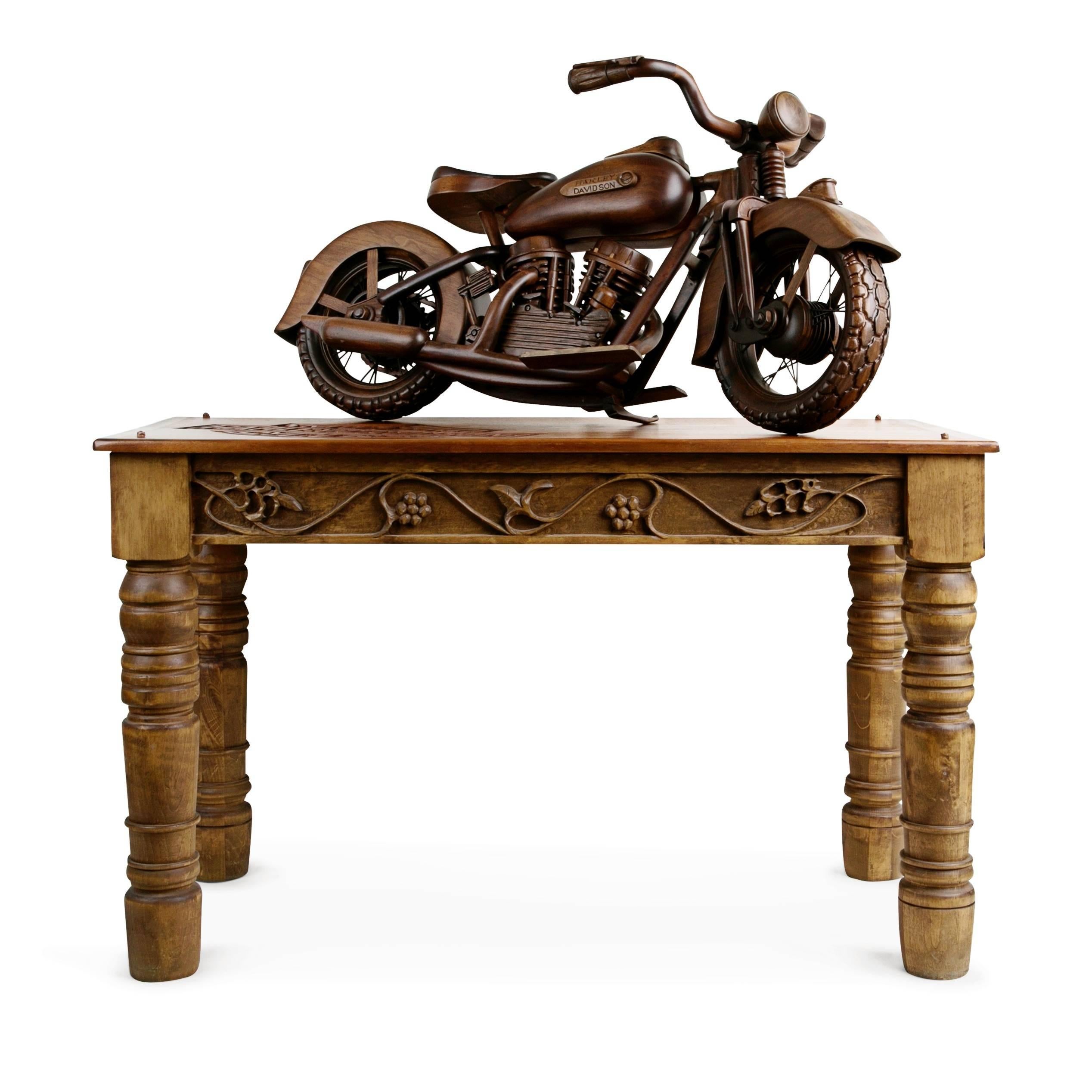 Large-scale model of a 1948 EL Panhead Harley Davidson with custom made display case fabricated in 1991 by woodworker John Hanson. This expertly crafted model has been intricately constructed to the highest detail utilizing various tones of walnut