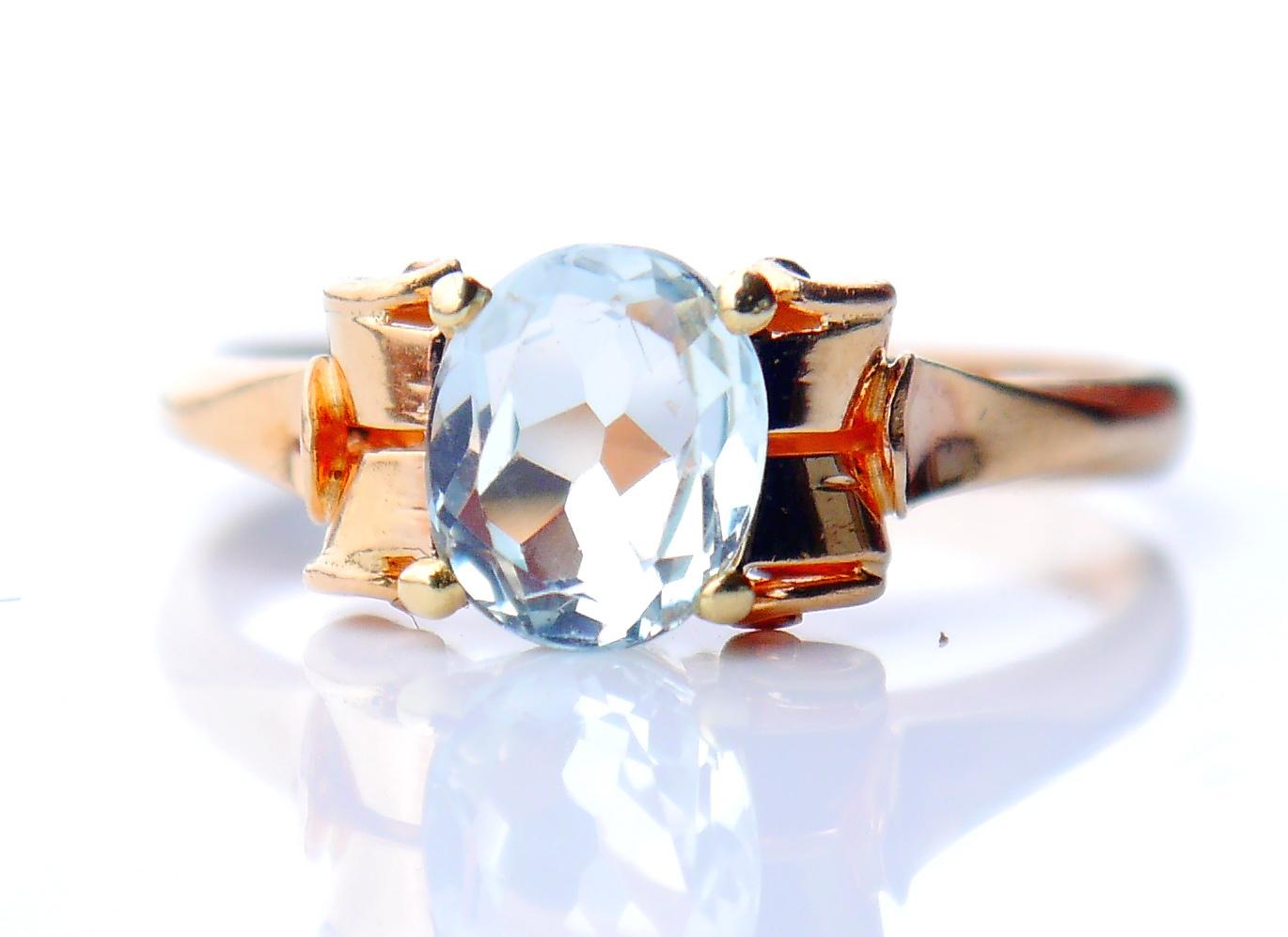 Beautiful Ring for a female hand. Frame in solid 18K Orange ( band) Yellow (claws) Gold.

Claw set natural light Blue Aquamarine with tint of Green measuring 7.25 mm x 6 mm x 3.5 mm deep / about 1 ct. Top side of the stone shows oval / old diamond