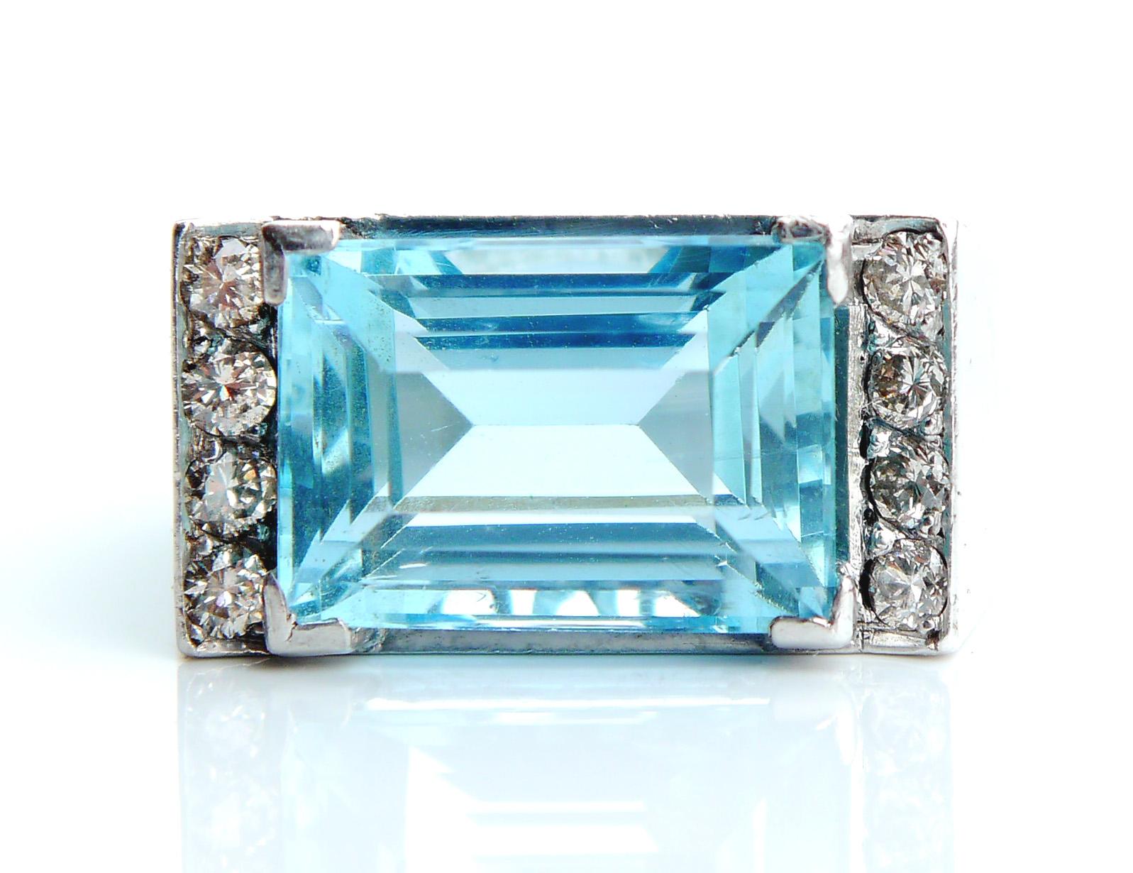Aquamarine and Diamonds Ring in solid 18K White Gold.

Fine emerald /step cut natural Blue Aquamarine measuring about 12.85 mm x 8.86 mm x 7.15 mm deep / ca.7ct

The stone is of vivid pure and intensive Blue color/eye clean /transparent, very bright