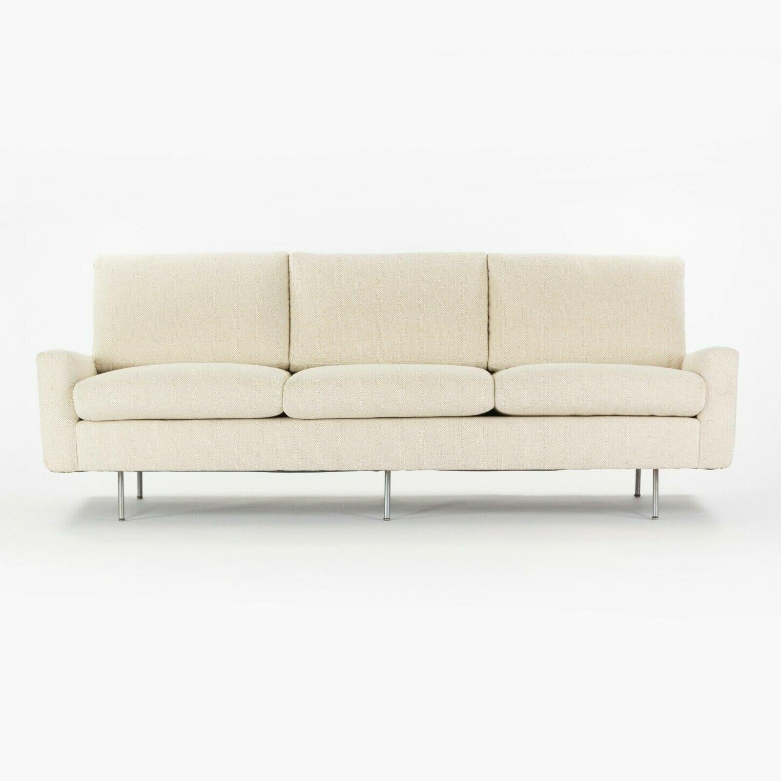 Listed for sale is a 1949 Florence Knoll for Knoll Associates 26 BC upholstered 3-seater sofa, which was just freshly reupholstered by Forthright, a renowned upholstery shop based in NYC and Connecticut. This example is in gorgeous condition,