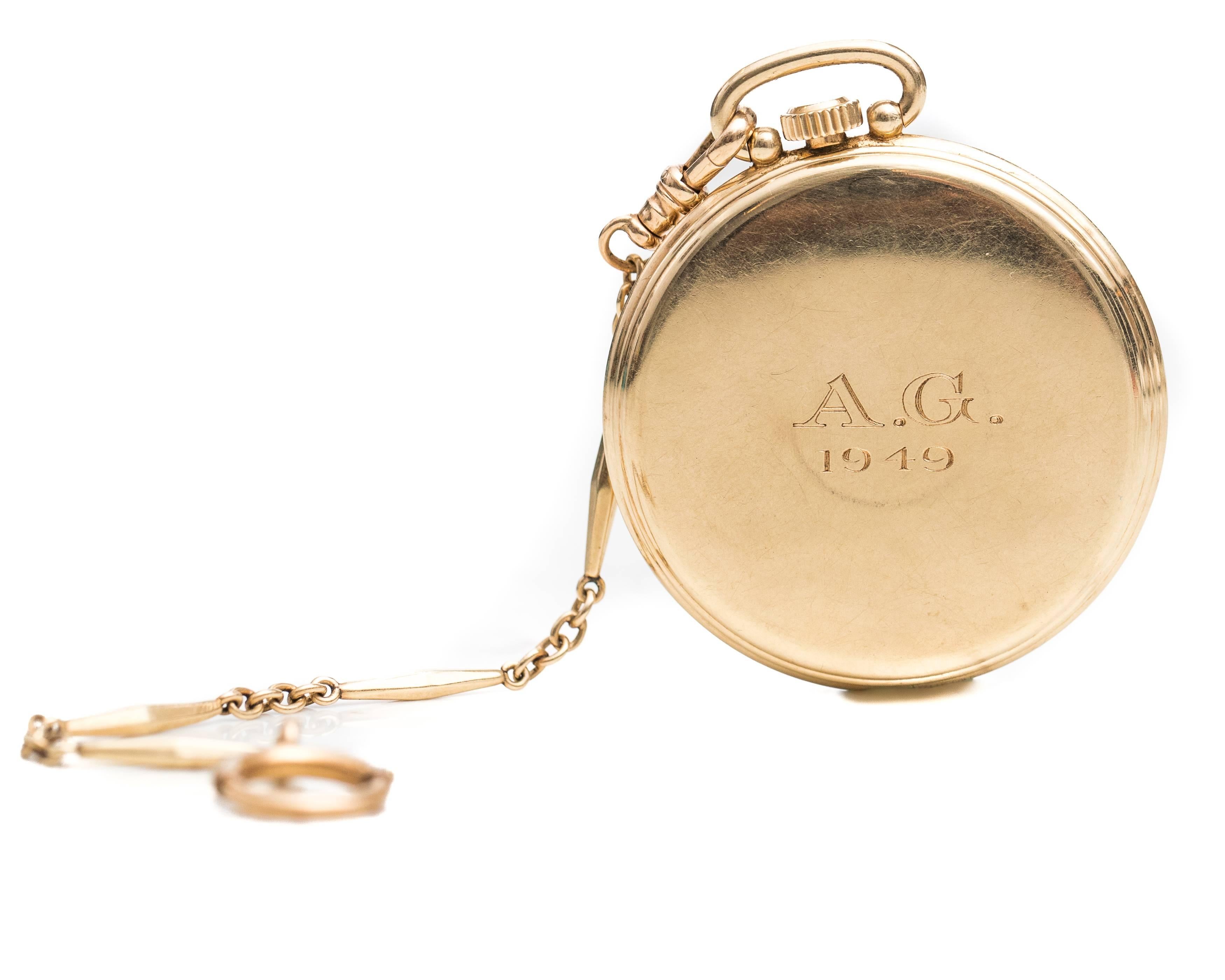 1949 Hamilton 14 Karat Yellow Gold Pocket Watch

Features a silvery antique white dial, gold Arabic numbers, gold Alpha hands and a Seconds Subdial at the 6:00 position. This stunning Gold Pocket Watch has a smooth, high polish back. The back is