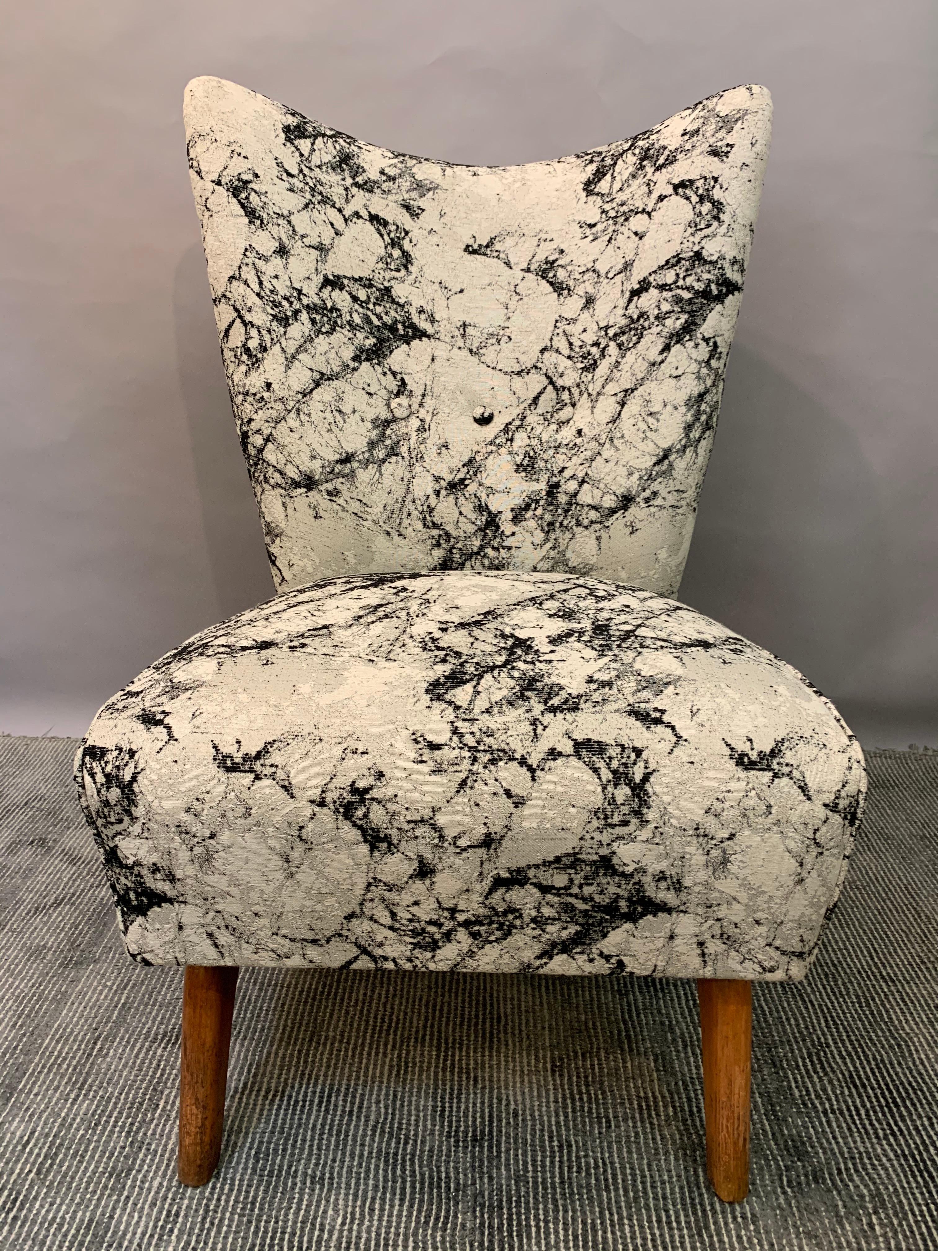 Vintage 1949 Howard Keith 'Bambino' encore lounge or cocktail chair. The chair has been recently re-reupholstered in a grey and white marble effect fabric with the three distinctive buttons along the lower-middle back of the chair. The chair is very