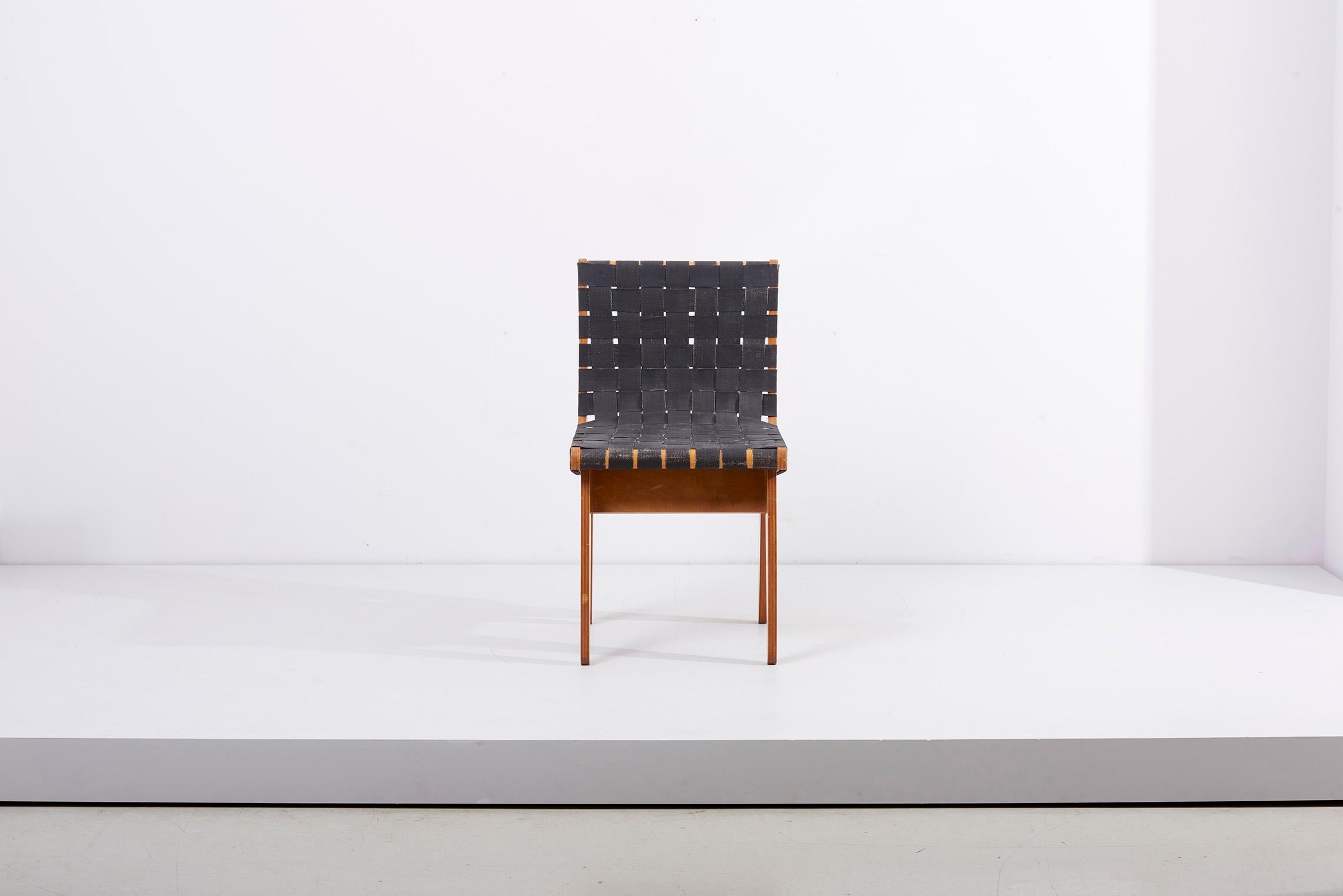 Hand built chair with new black strapping and pitch pine frame, 1949. Klaus Grabe was a German designer and architect who emigrated to the United States with fellow Bauhaus members in 1933. Influenced by Breuer's works in plywood, Grabbe's designs