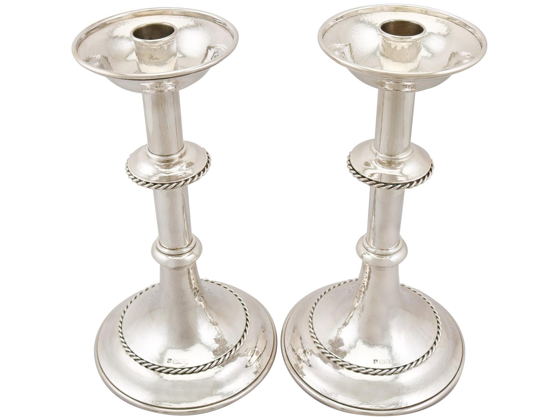 An exceptional, fine and impressive pair of large vintage George VI English sterling silver alter candlesticks in the Arts & Crafts style; part of our ornamental silverware collection.

These exceptional vintage George VI sterling silver alter
