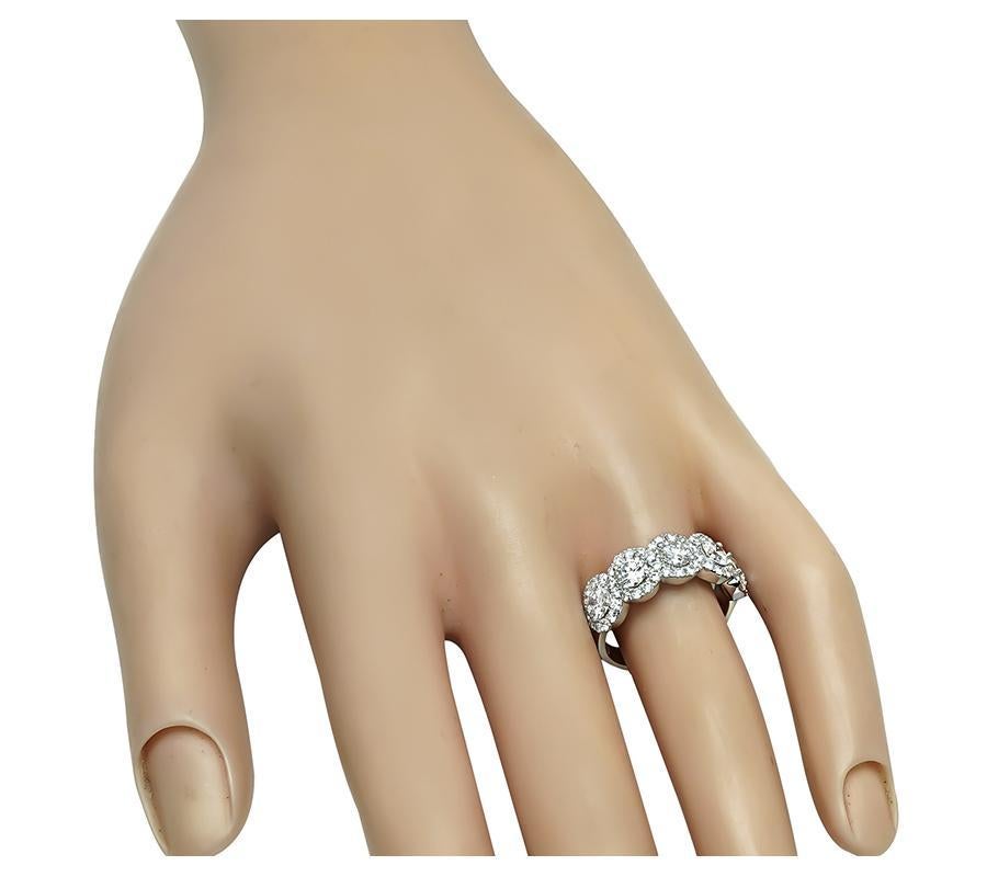 This is a gorgeous 14k white gold ring. The ring is set with sparkling round cut diamonds that weigh approximately 1.94ct. The color of these diamonds is G-H with VS clarity. The top of the ring measures 7.5mm by 21.5mm. The ring is stamped D1.33