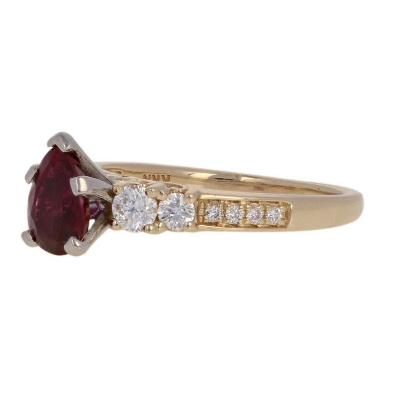 Marked by spectacular beauty, this ring will be an exceptional choice for your sweetheart! This majestic piece showcases a GIA-graded pear cut ruby solitaire that is accompanied by a sparkling collection of diamond accents set in 14k yellow and