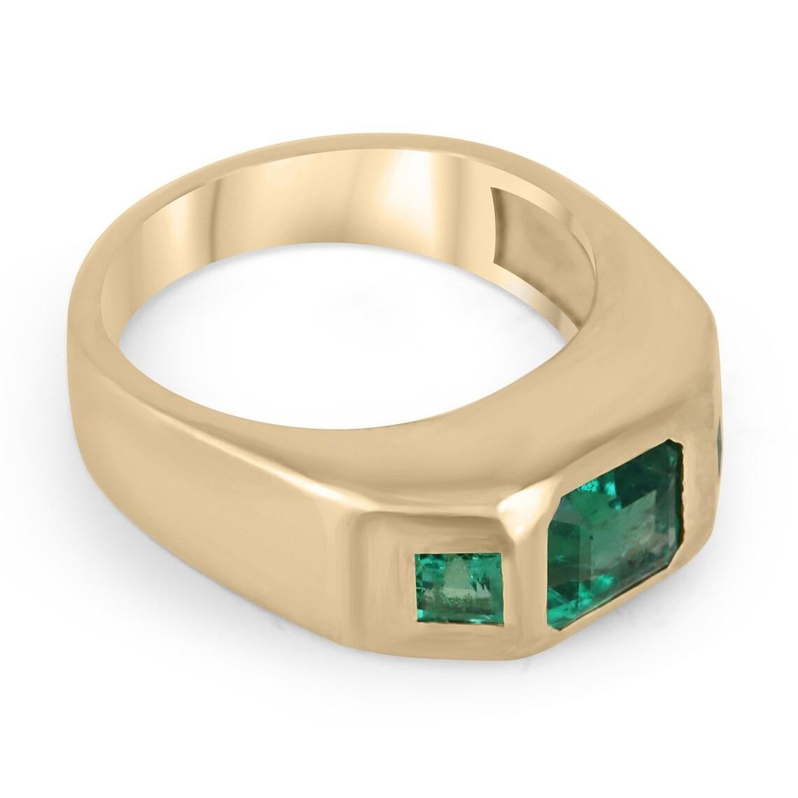 This beautiful three stone ring features an asscher cut emerald as its centerpiece, with two princess cut emeralds on either side, creating a stunning trio of green stones. The emeralds are set in a 14k gold bezel setting with a matte finish, giving