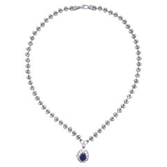 Collana aureola in platino con diamante e zaffiro blu da 1,95 carati