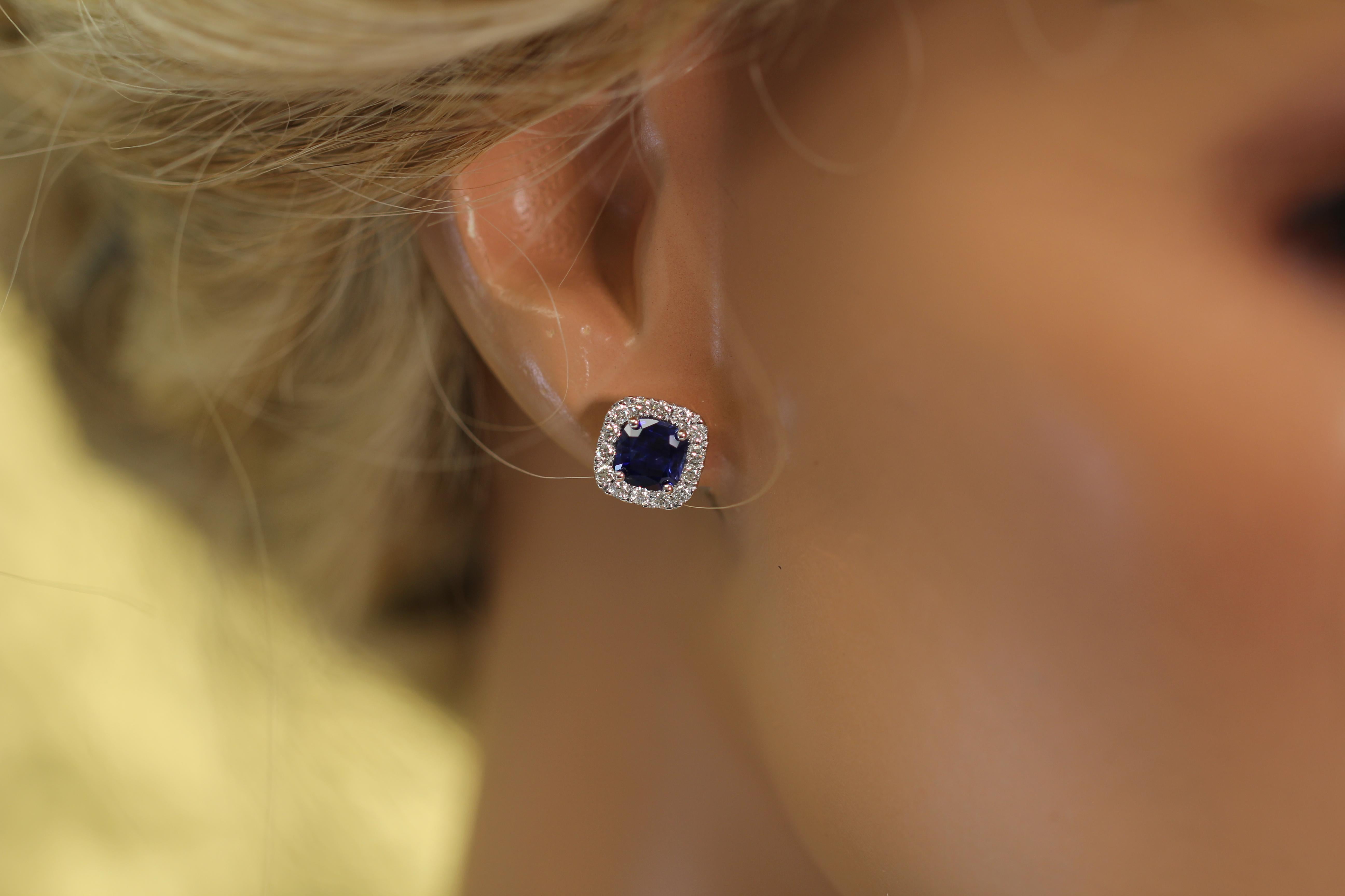Admire these exquisite halo stud earrings boasting a combined total of 1.95 carats of Cushion cut sapphires and 0.52 carats of diamonds. This timeless piece is a perfect choice and an ideal gift!

At DiamondTown, we take immense pride in presenting