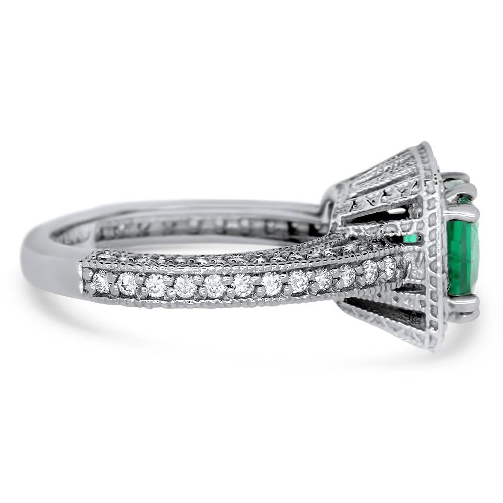 Material: 14k White Gold 
Center Stone Details: 1 Cushion Cut Natural Emerald at 1.95 Carat 
Mounting Diamond Details: 112 Round White Diamonds Approximately 0.83 Carats - Clarity: SI / Color: H-I
Alberto offers complimentary sizing on all