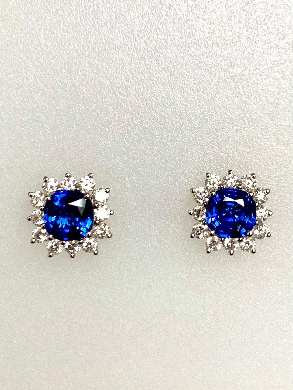 1.95 Carat cushion sapphire set in 18k white golg earrings surrounded  with 0.68 carat diamonds , G-h SI1.