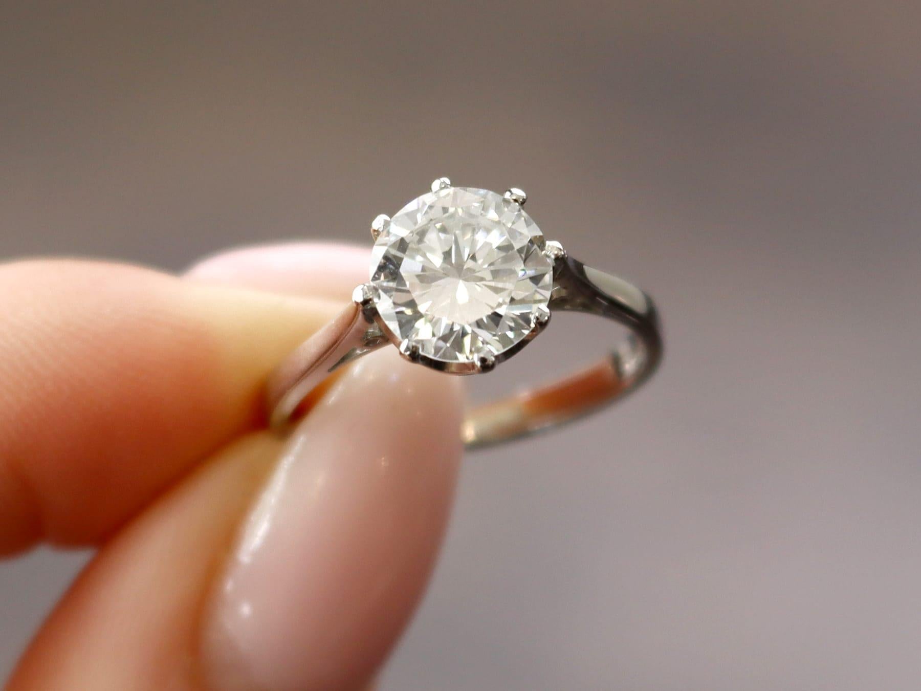 A stunning, fine and impressive vintage 1.95 carat diamond and contemporary platinum solitaire ring; part of our diamond jewelry / estate jewelry collections.

This stunning diamond solitaire ring has been crafted in platinum.

The sympathetic