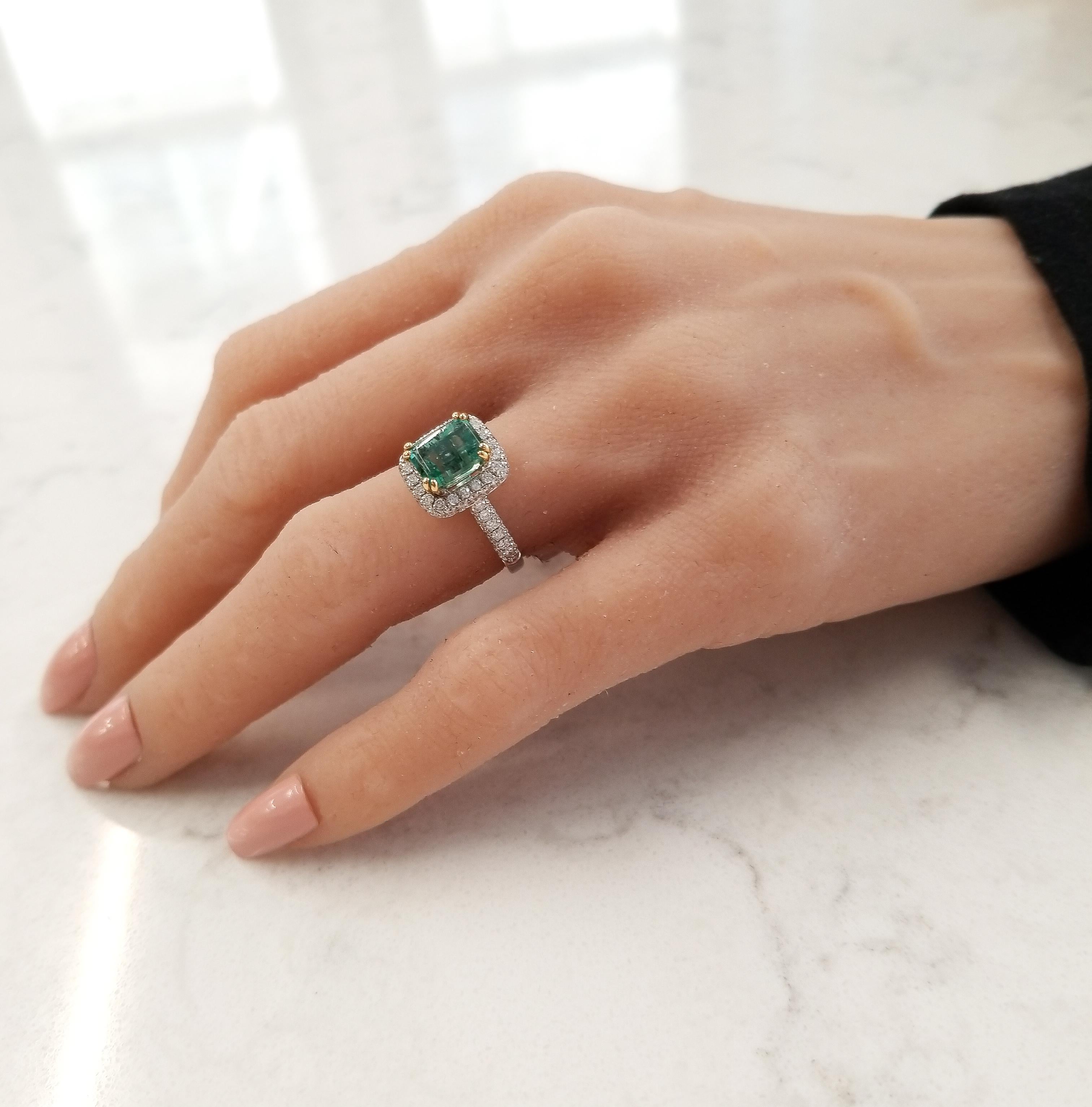 This is a 1.95 carat vibrant grass-green emerald that is skillfully set in the center of this incredible ring measuring 8x6MM. This gem origin is Brazil, its transparency and color are unparalleled to others. This gem is set in a rich yellow gold