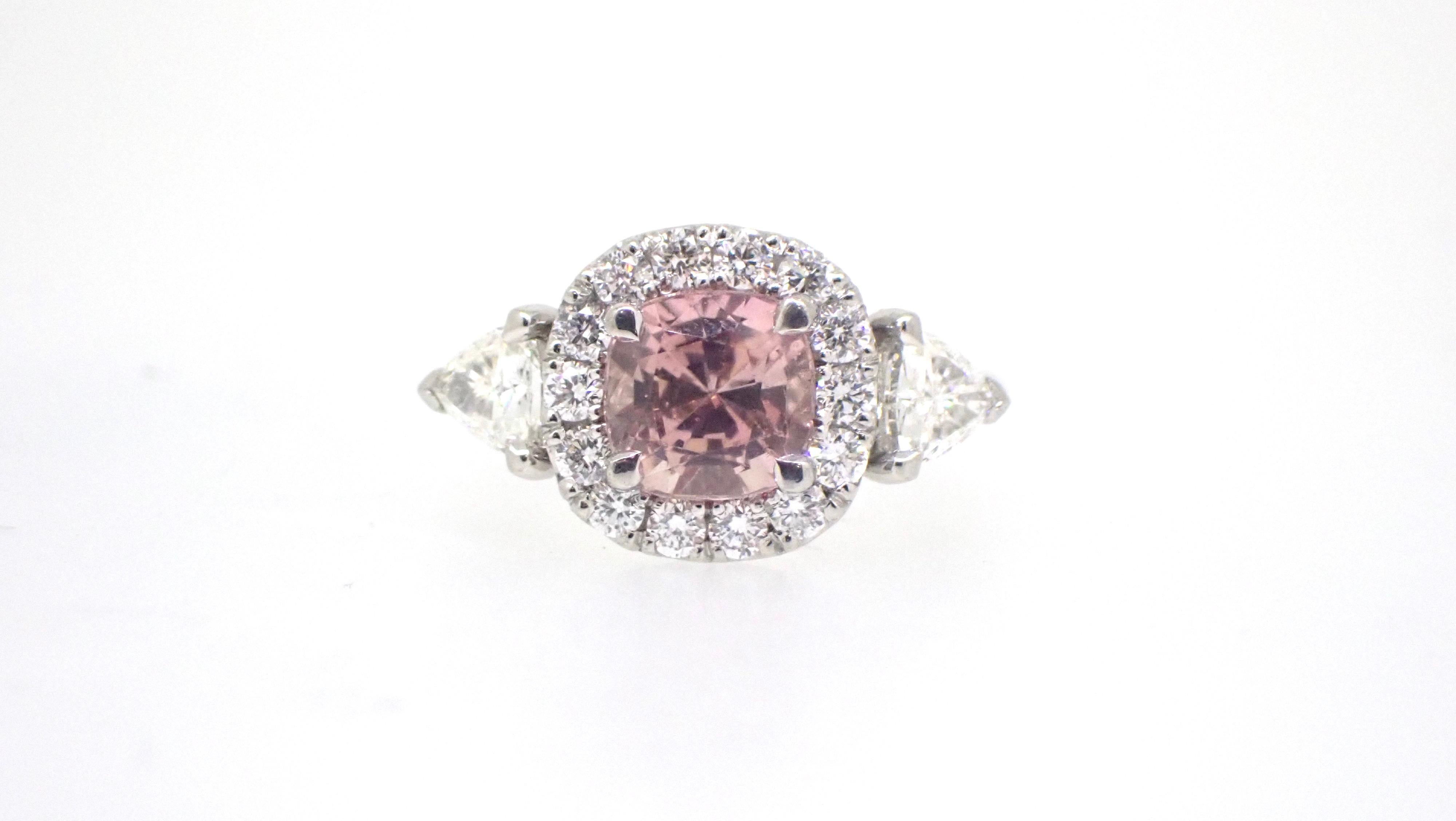 The romanticism of this 1.95 Carat Pink Tourmaline Diamond Platinum Engagement Ring is breathtaking. The colour of the pink tourmaline could be confused with a pink diamond, but it is definitely a blush coloured, cushion cut tourmaline!

Set in
