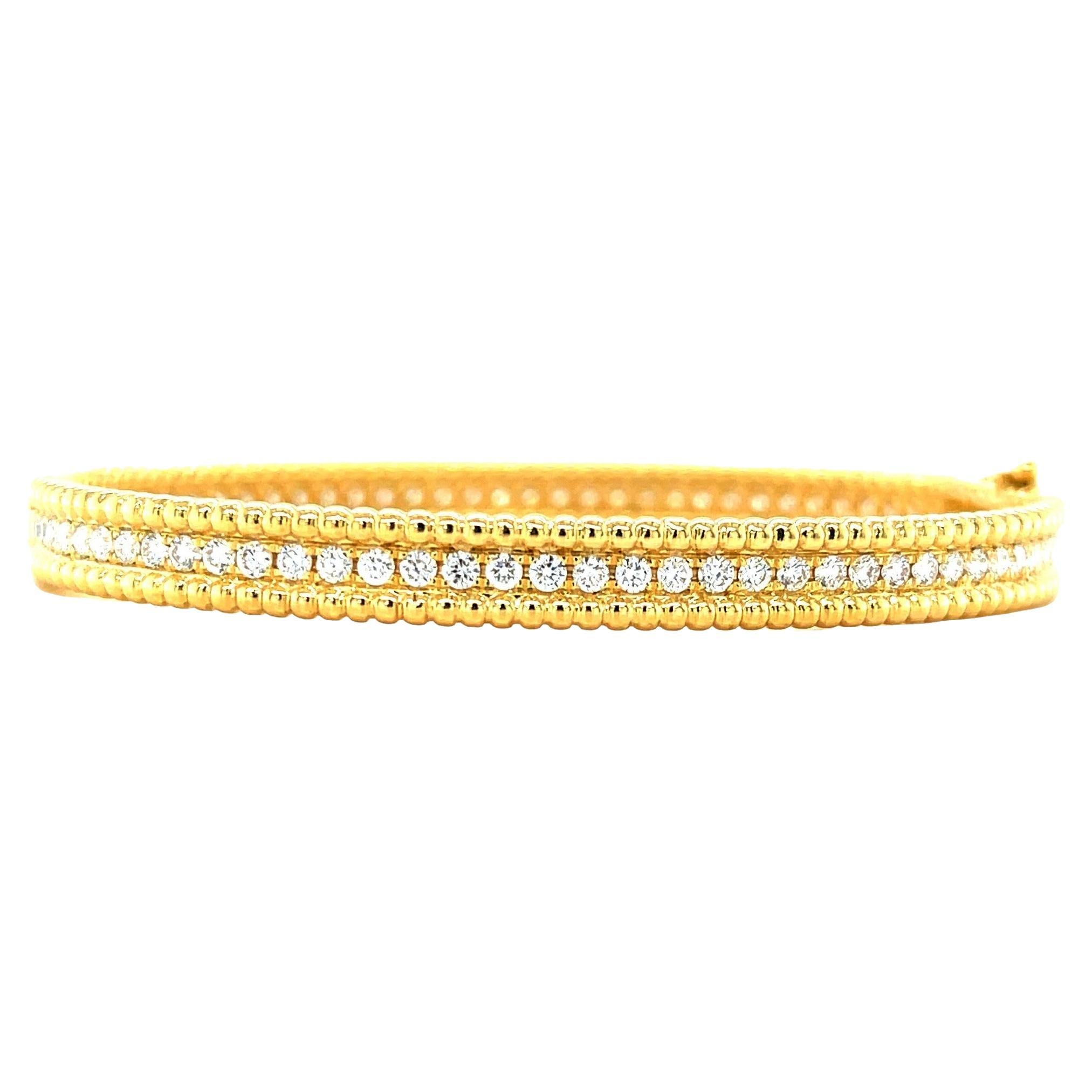 This beautiful diamond bangle will make a perfect signature bracelet whether you're 25 or 85! Nearly 2 carats of sparkling, round brilliant diamonds are individually hand-set down the center of this exquisite 18k yellow gold bracelet. The intricate,