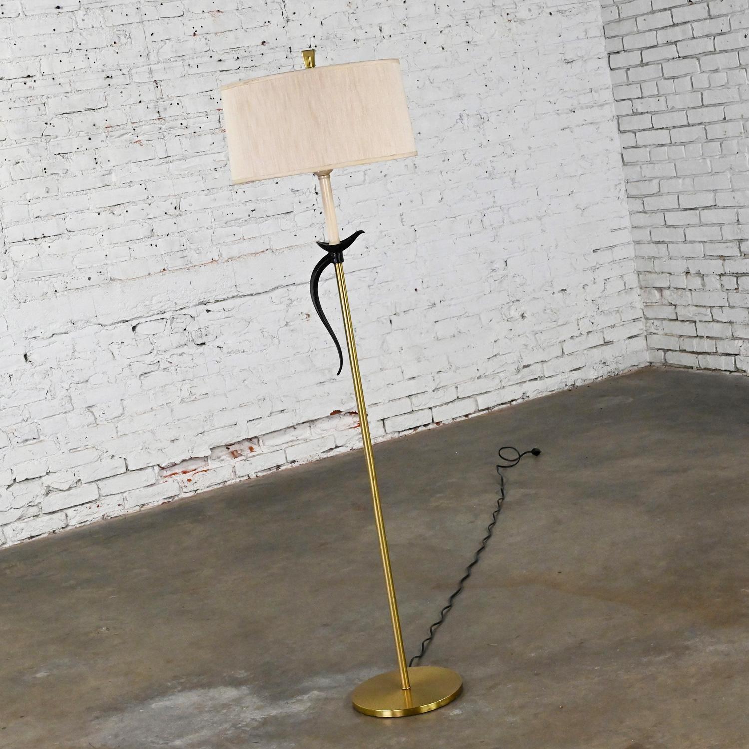 Gorgeous vintage MCM (Mid-Century Modern,) or Hollywood Regency style floor lamp with a brass plated base and shaft, and black stylized Pheasant Tail candle holder along with its original beige silk fabric drum shade. Beautiful condition, keeping in
