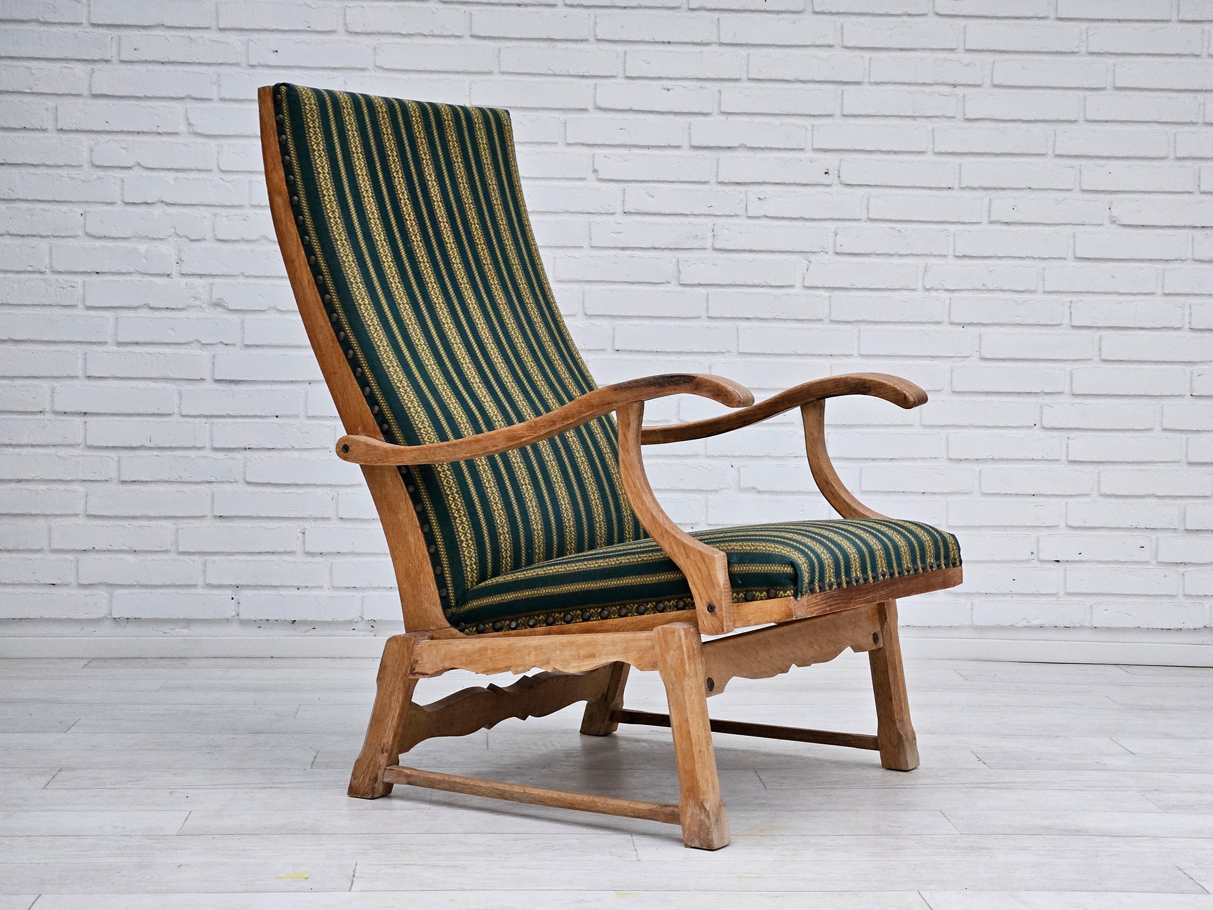 1950-60s Danish highback rocking chair in original very good condition. No smells and no stains. Furniture wool and oak wood. Manufactured by Danish furniture manufacturer in about 1955s.