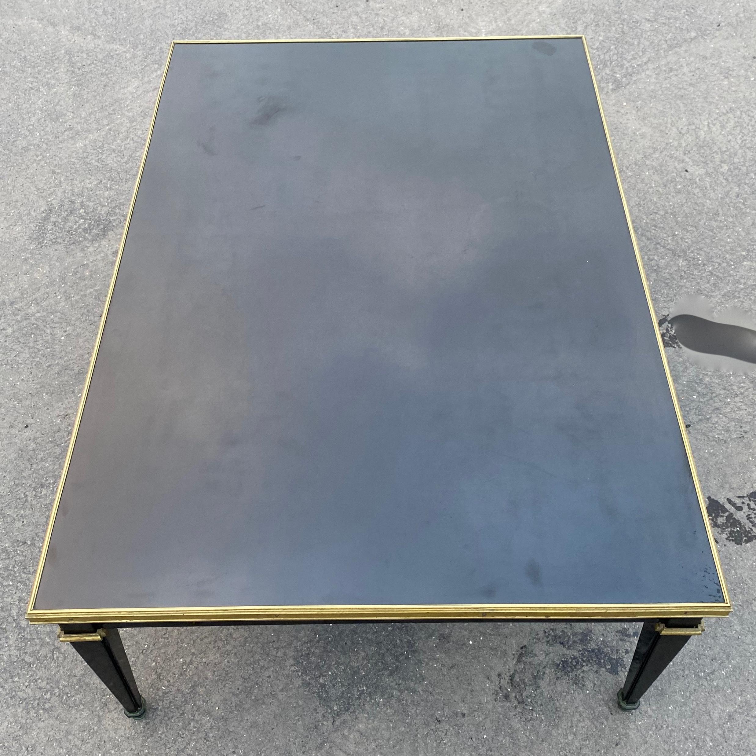 1950/70 Coffee Table Wood Lacquered Black Maison Jansen 120 x 80 cm
Maison Jansen coffee table lacquered wood and gilded bronze ornaments, directoire style, circa 1950/70,by Gerard MILLE
Condition of use 
Come from LAZARD Bank 
Length: 120 cm
Width: