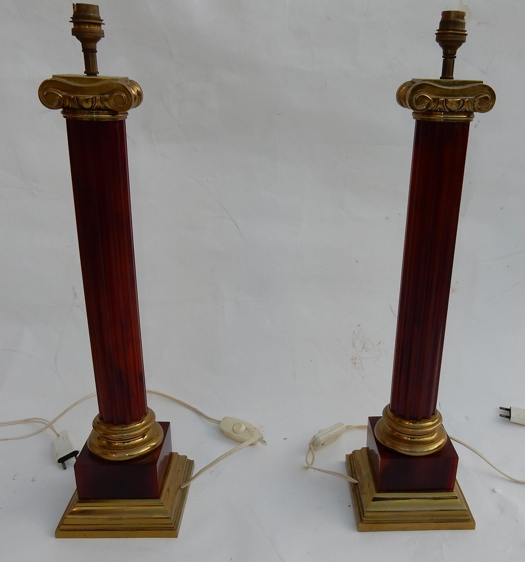 Pair of orange Bakelite lamps imitating amber, the barrels are fluted, column decoration with Corinthian capitals, in the style of Maison Jansen, circa 1950-1970
Measures: Base width and length 15 x 15 cm
Height 59 cm
Diameter of the column 6