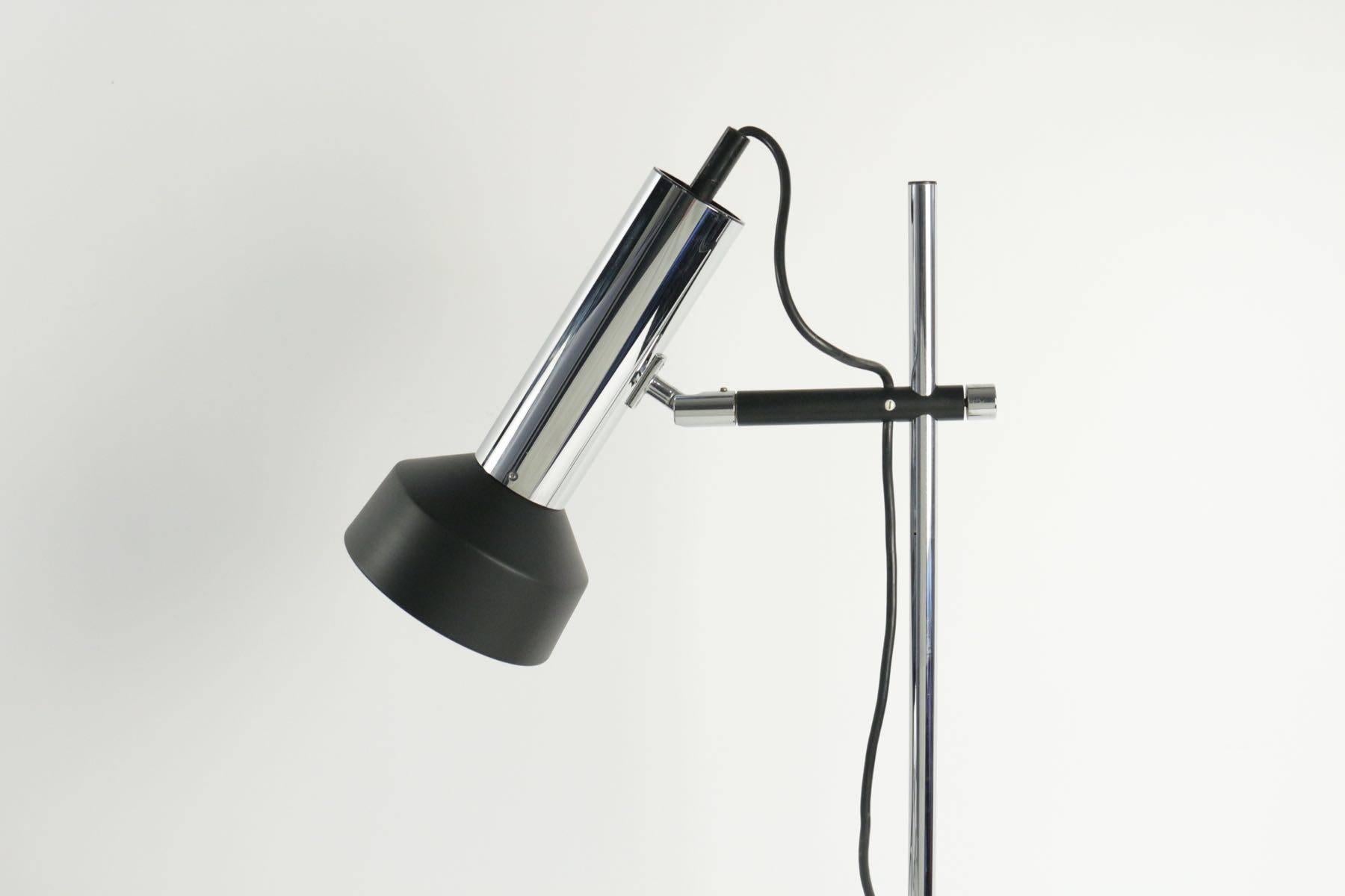 1950 adjustable desk lamp by Arlus.

Made of chrome and black lacquered metal. The lamp base is made of solid black painted cast iron. The height of the light can by adjusted, as the orientation of the lampshade.

Excellent condition.
 
