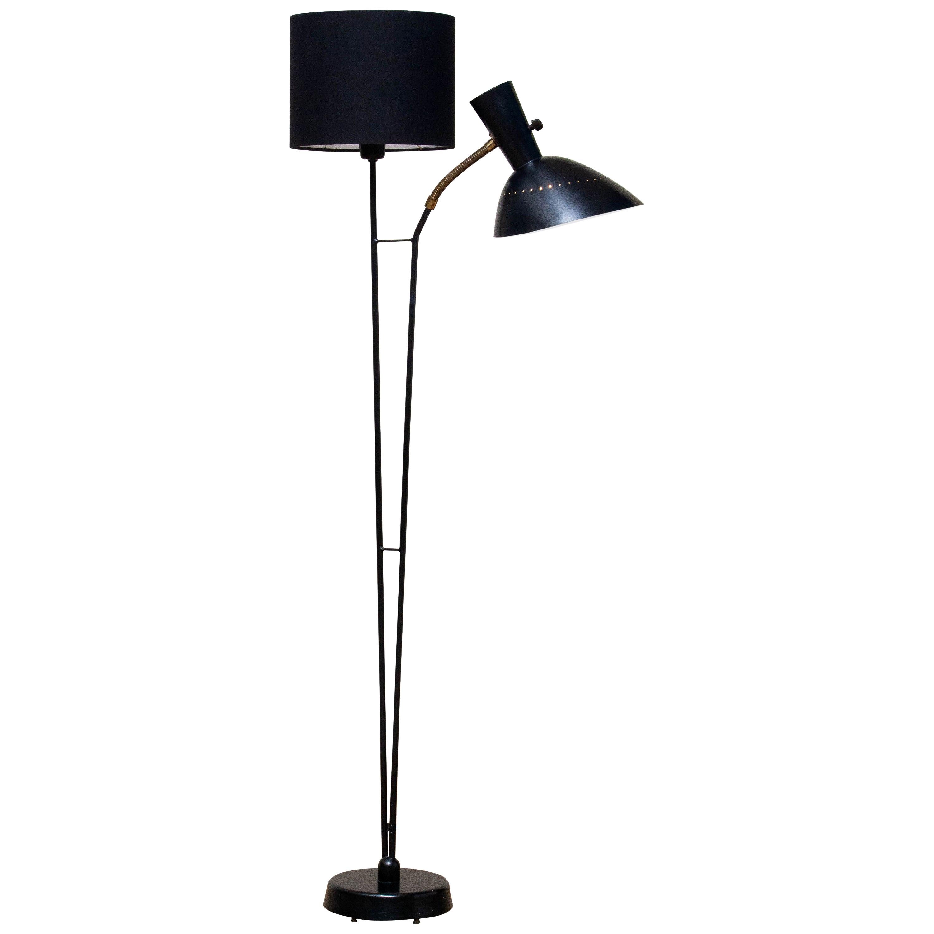 Beautiful and rare floor lamp made in the 1950s. Designed by Hans Bergström for Ateljé Lyktan in Sweden.
Measures: Height 136 cm or 54 inches.
Wide 60 cm or 24 inches.
Technically 100% and the overall condition is good.
The black fabric shade is