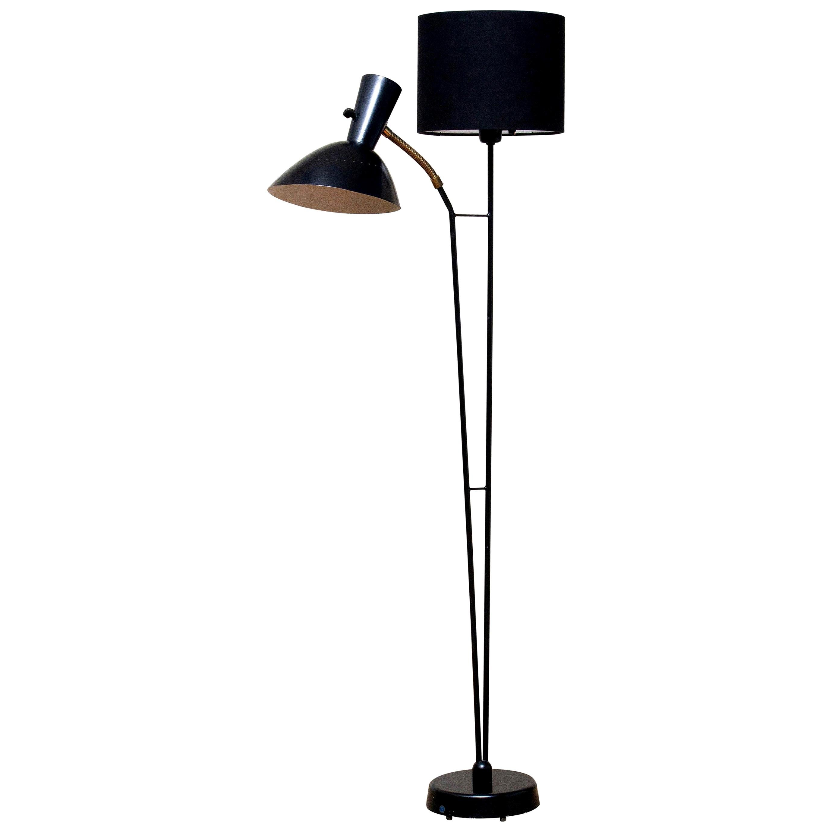 Beautiful and rare floor lamp made in the 1950s. Designed by Hans Bergström for Ateljé Lyktan in Sweden.
Measures: Height 136 cm or 54 inches.
Wide 60 cm or 24 inches.
Technically 100% and the overall condition is good.
The black fabric shade is