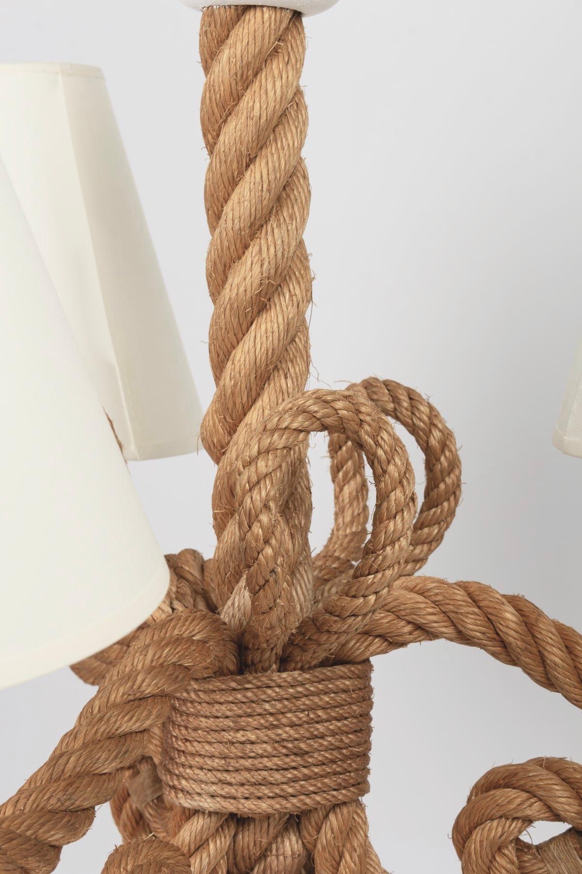 The chandelier is composed of three curved luminous arms in braided rope. These three arms meet on the lower part and form pretty curls.
Three shades of off-white cotton matched to the originals.

Adrien Audoux and Frida Minet are known for their