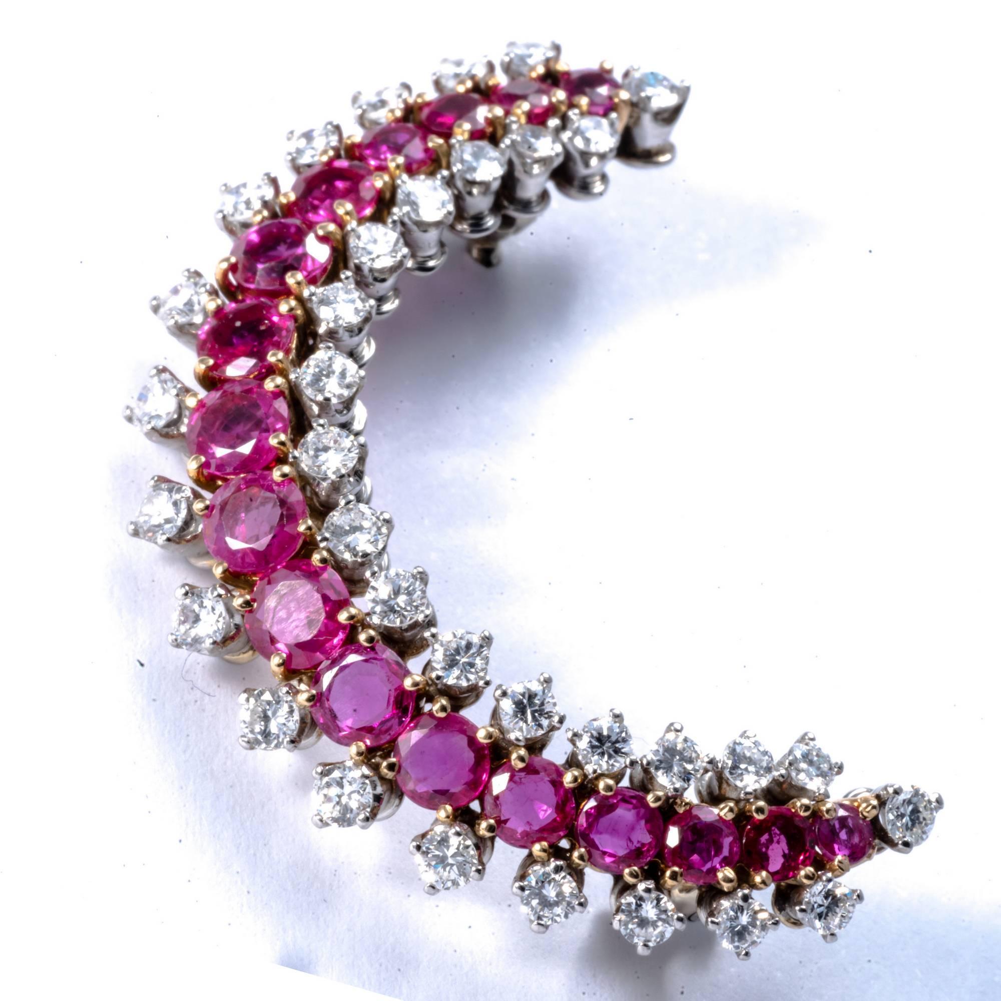 This 1950 original pin has the shape of the crescent moon and it is entirely hand made in yellow and white gold. The 34 diamonds and 17 rubies that enlighten the brooch, are perfectly combined for color and dimensions to emphasize the sleek and