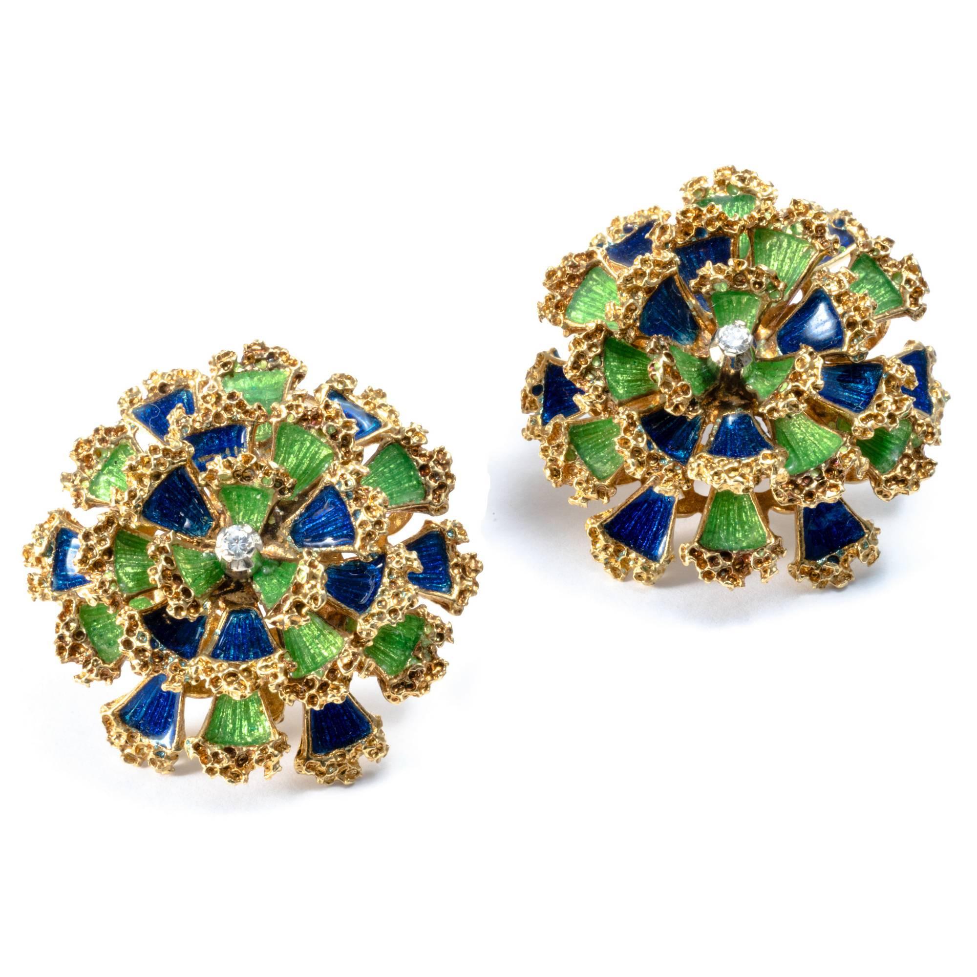 These yellow gold 1950's dome floral earrings are lively and appealing with their bright blu and green enameled petals, enlightened by 2 diamonds. 