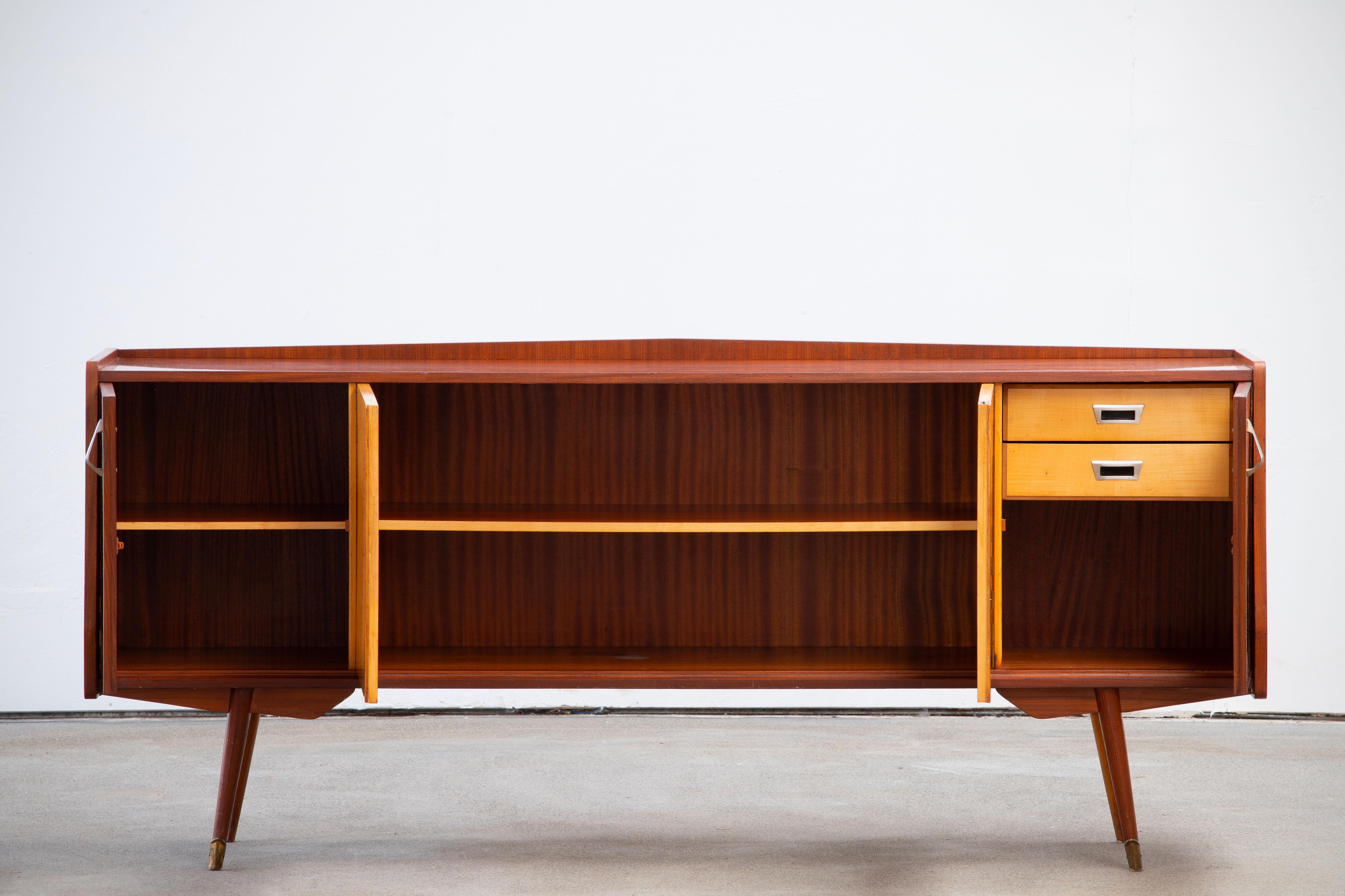 Credenza, walnut, maple, France, 1950s

This sideboard is elegant in every way. This piece is playful and airy.