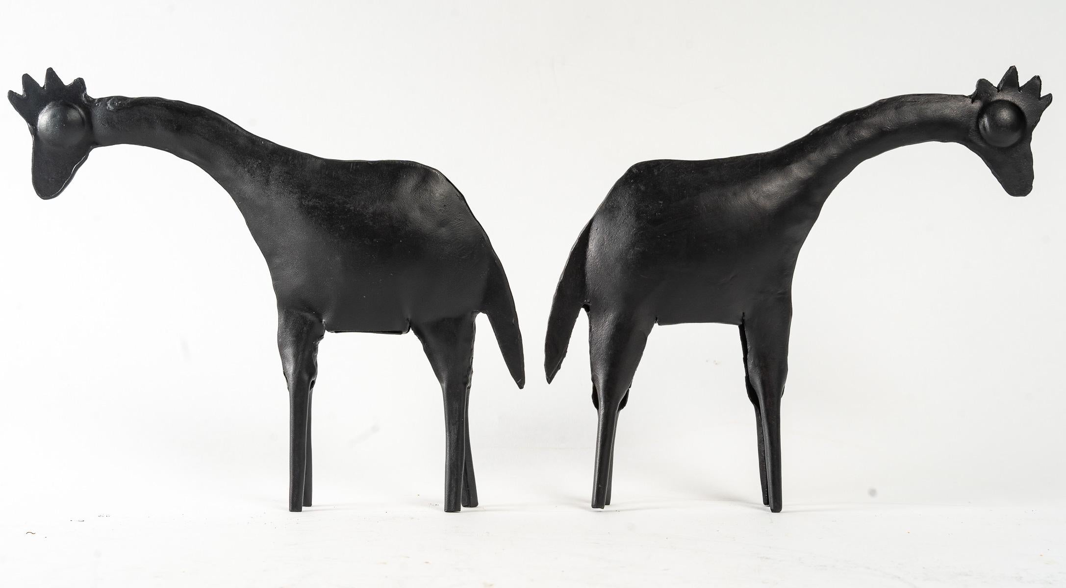 These stylized giraffes are made from two pieces of sheet metal, hand-worked and lightly hammered together to a fine, delicate finish.
They stand on 4 tapering feet.
The work is akin to Brutalism, with the neck and head adorned with a mane and tail.