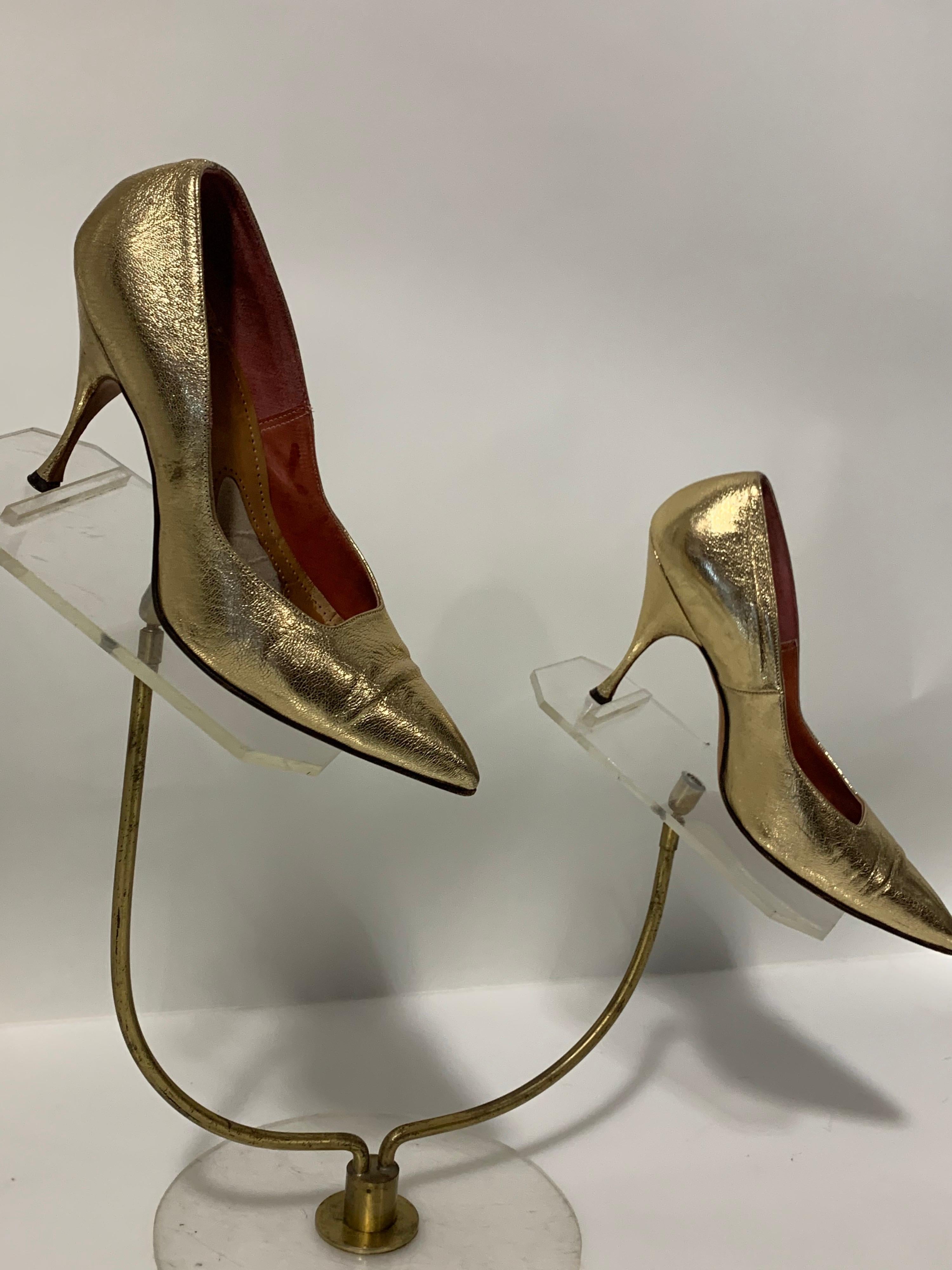 1950s Gold metallic leather stiletto pumps with square cut vamp, pointed toe and leather soles. Made in Germany. Size 7B.