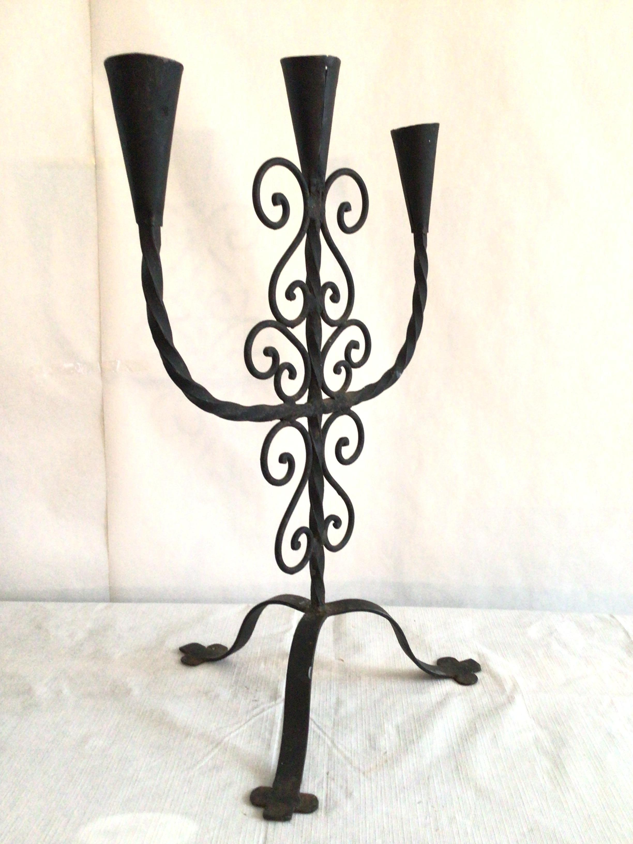 1950 Hand wrought iron candle holder - tripod base and scroll work add a nice presence for any interior setting.
