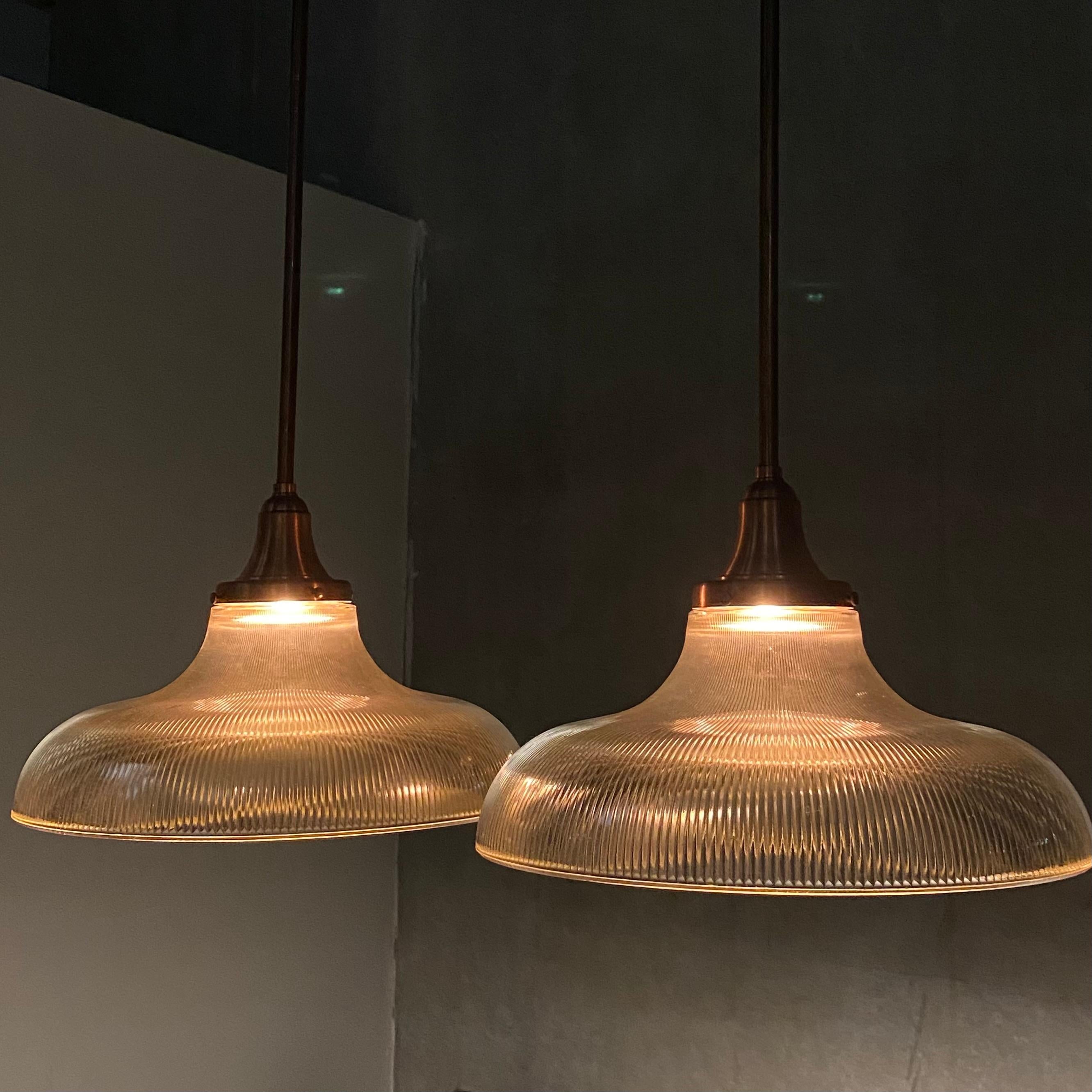 A very nice pair of Copper stem large holophane pendant lights with easy mounting plate, rewired and csa approved.

Nice oversized unique size.