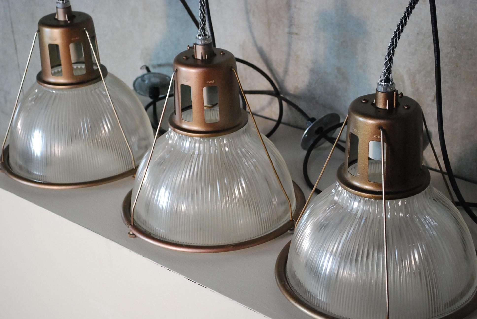Set of three at present .. we have applied a hand rub bronze finish on original fixtures . Wirong complete csa complete and they are ready to hang no issue. 
Salvaged from a warehouse in Montreal.- WE HAVE 20 IN STOCK 
PRICE PER ITEM