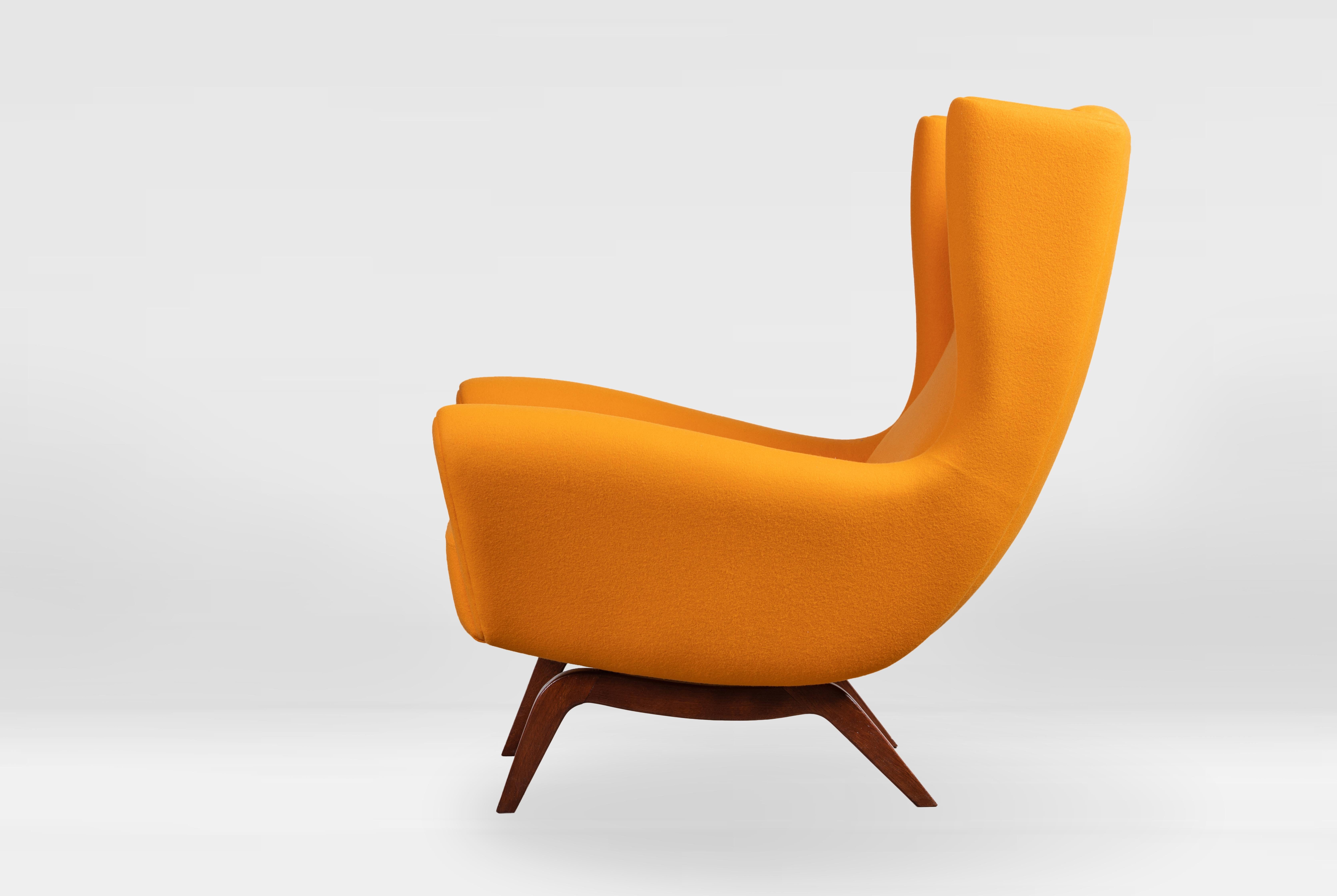 Illum Wikkelsø for Søren Willadsen, wingback chair 'Model 110', teak completely renovated and reupholstered in Dominique Kieffer orange wool.
