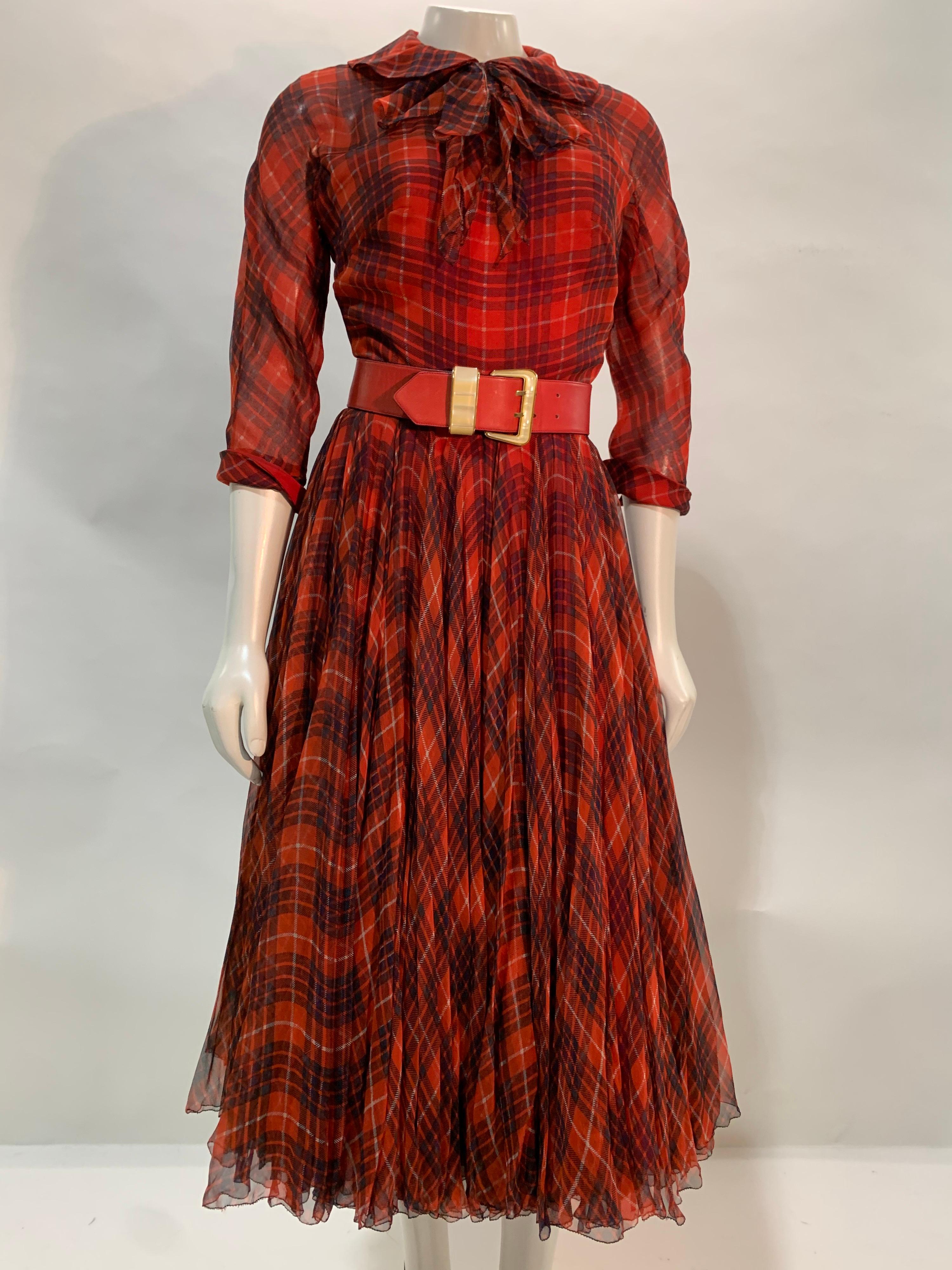 A stunning and rare 1950s James Galanos red and black plaid silk chiffon dress: full voluminous chiffon bias cut skirt, button-closure sheer chiffon bodice covers an under layer of structured and boned strapless red silk bodice. Back zipper. Chiffon